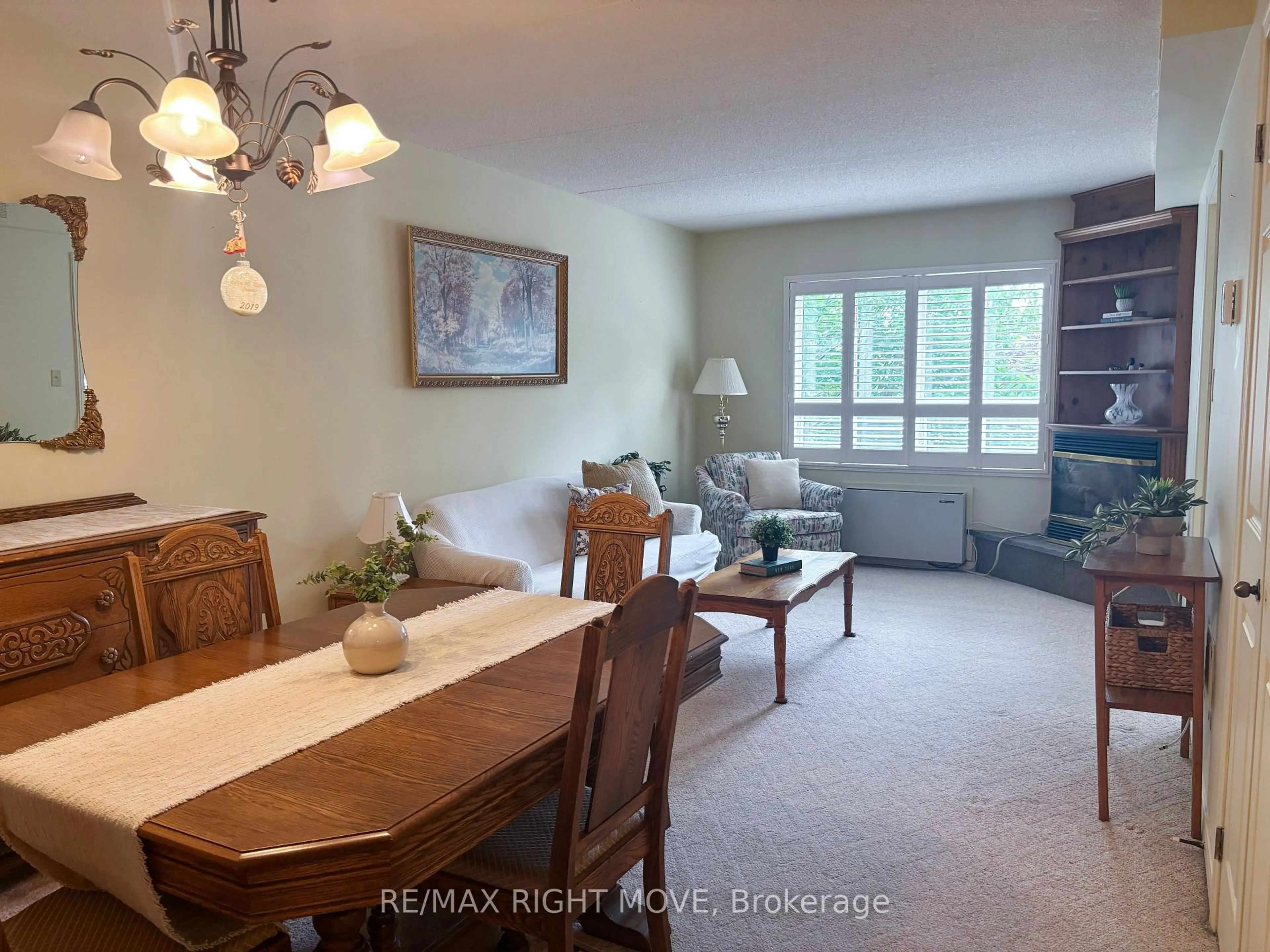 Living room with furniture, unknown for 54 Fittons Rd #202, Orillia Ontario L3V 3T9