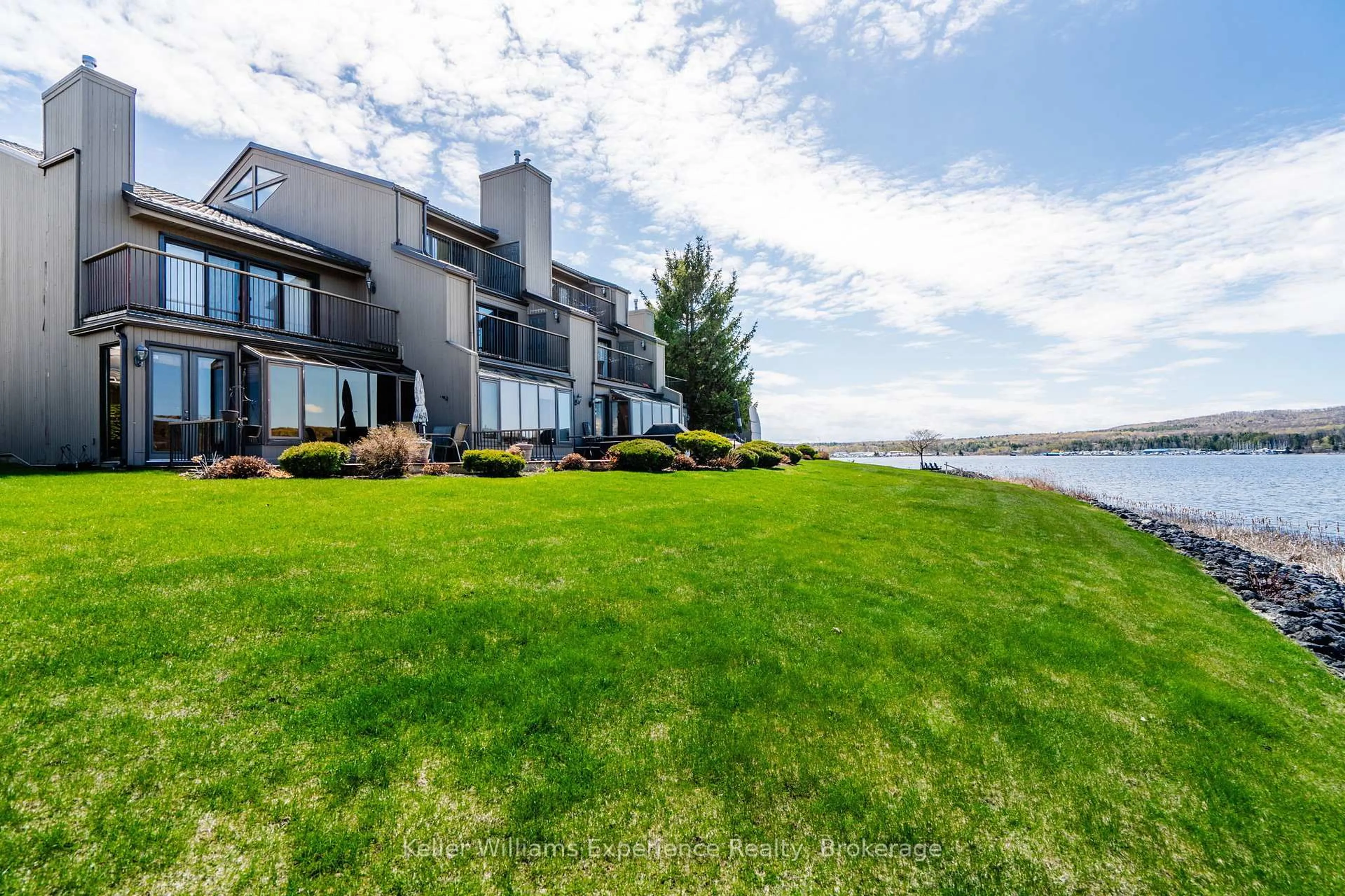 A pic from outside/outdoor area/front of a property/back of a property/a pic from drone, water/lake/river/ocean view for 8 Beck Blvd #5, Penetanguishene Ontario L9M 1C3