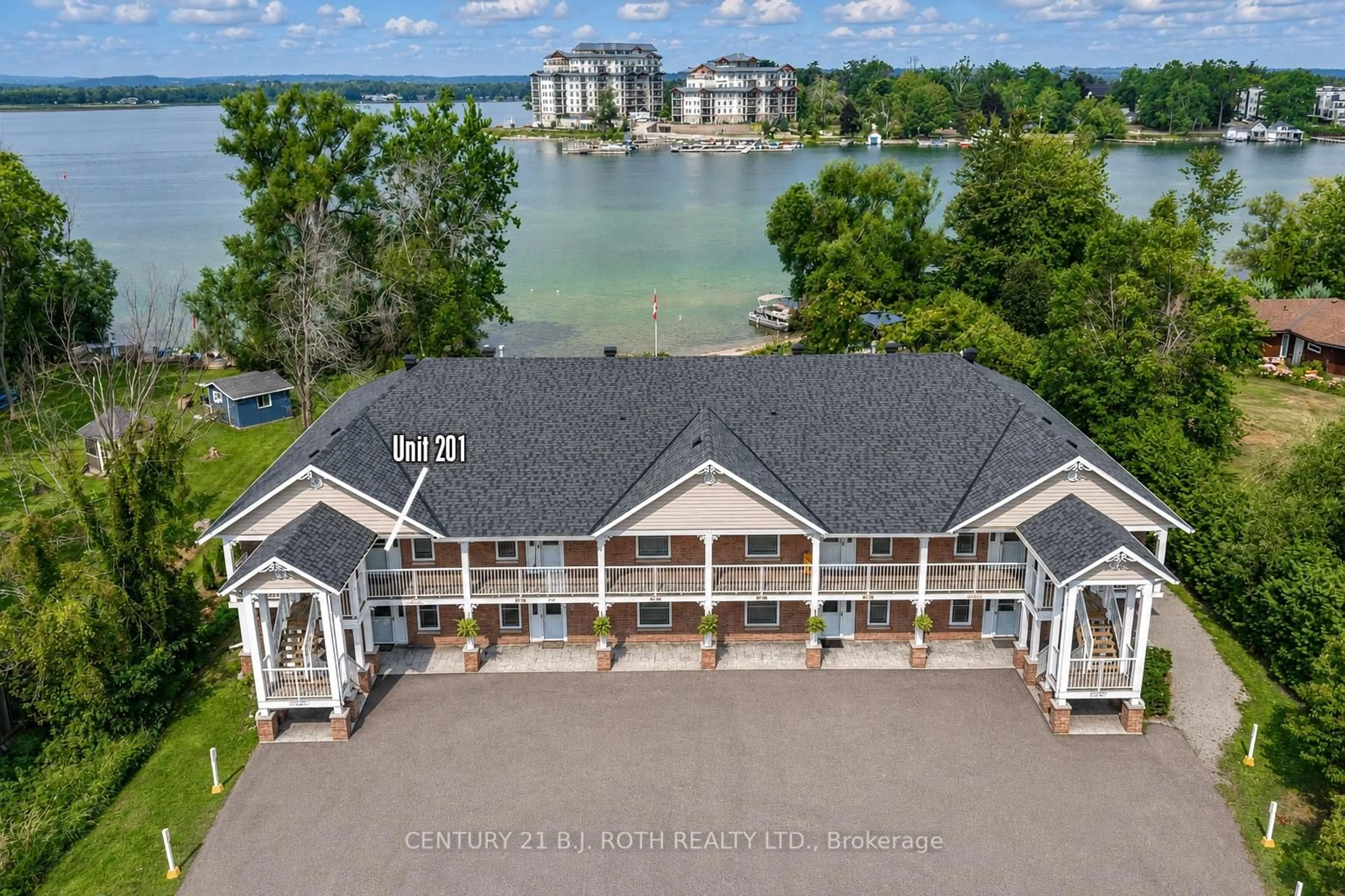 A pic from outside/outdoor area/front of a property/back of a property/a pic from drone, water/lake/river/ocean view for 43 Creighton St #201, Ramara Ontario L3V 1B1