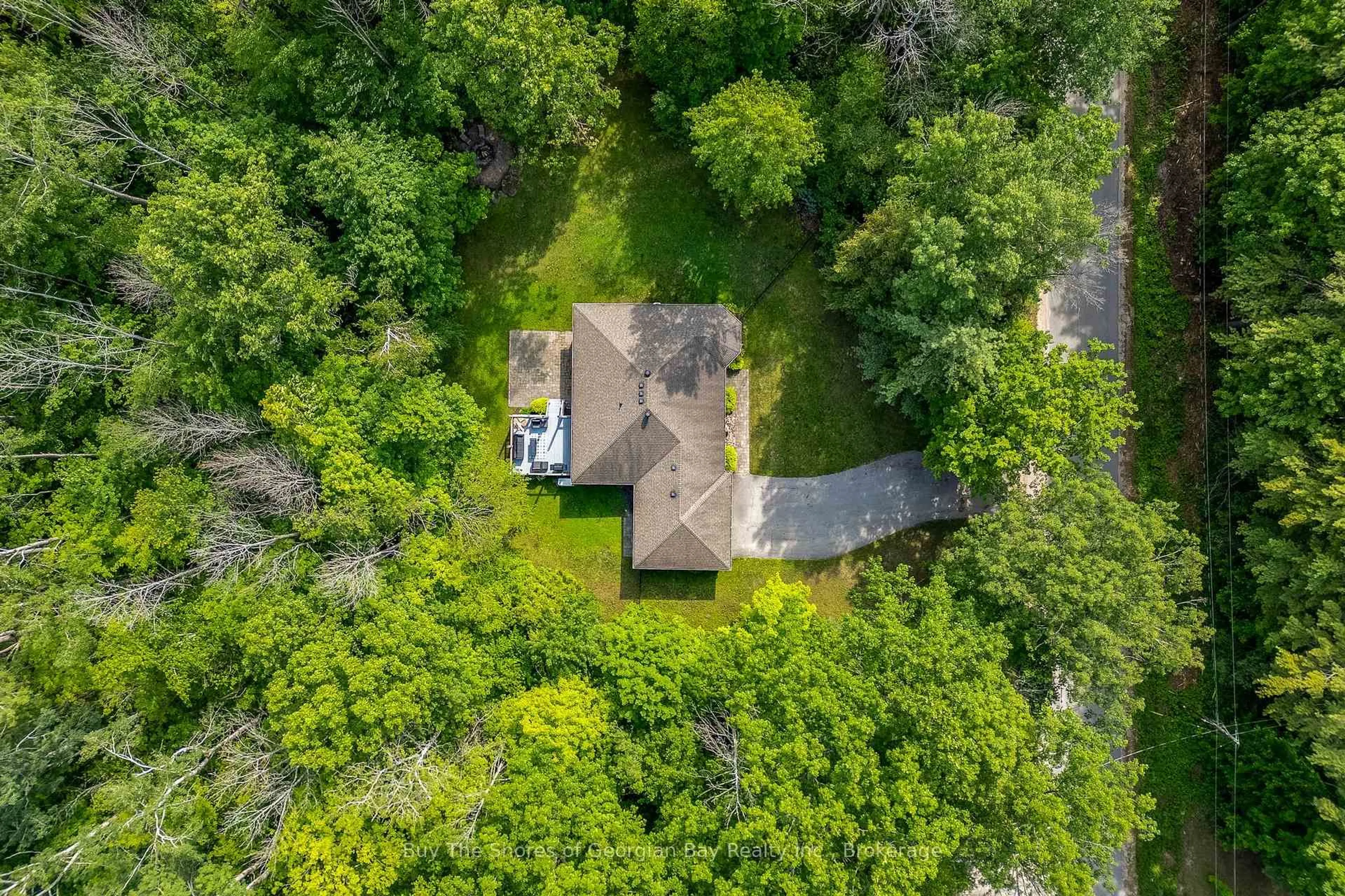 A pic from outside/outdoor area/front of a property/back of a property/a pic from drone, forest/trees view for 2367 MacDonald Rd, Springwater Ontario L0L 1P0
