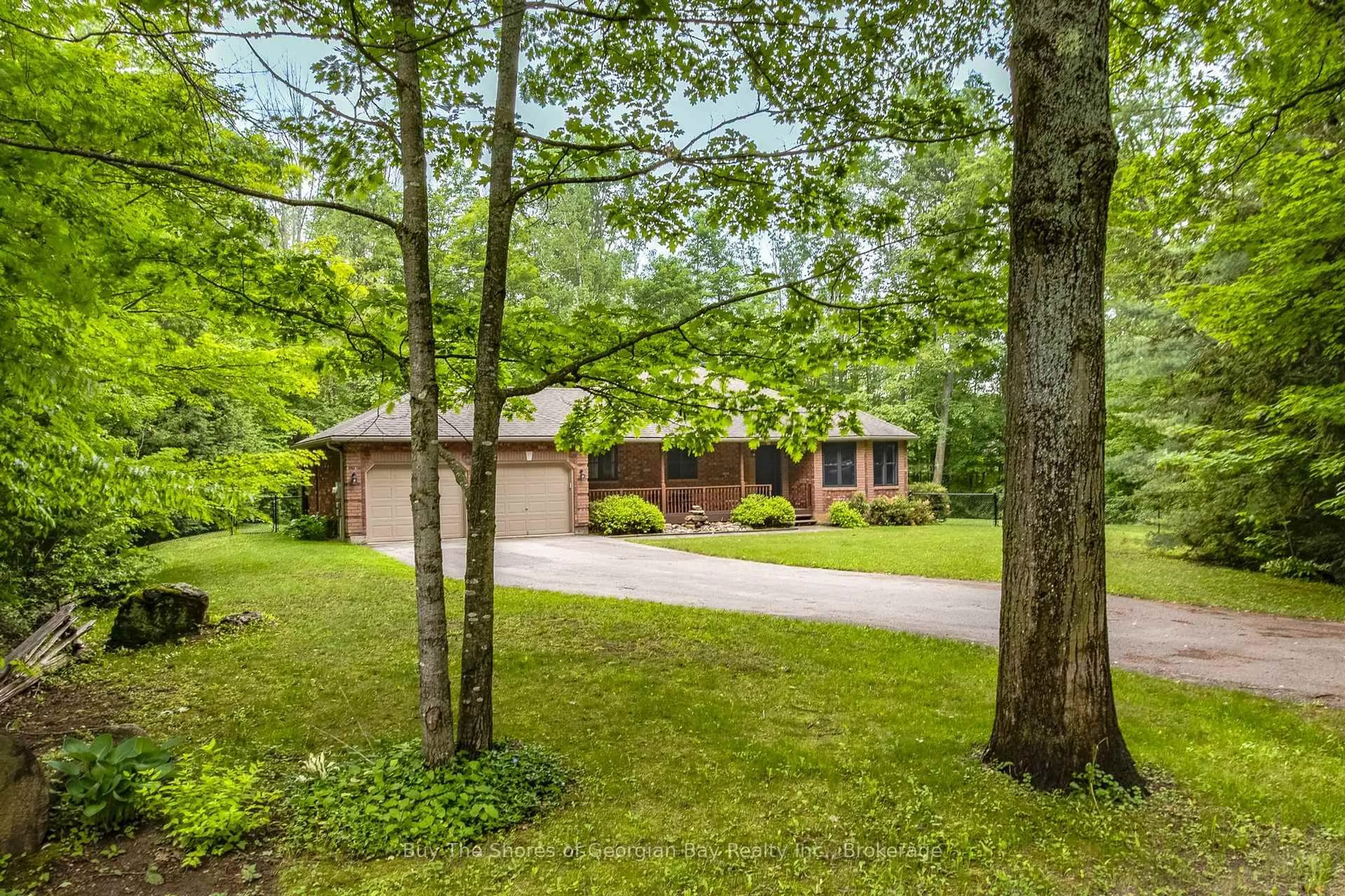 A pic from outside/outdoor area/front of a property/back of a property/a pic from drone, forest/trees view for 2367 MacDonald Rd, Springwater Ontario L0L 1P0