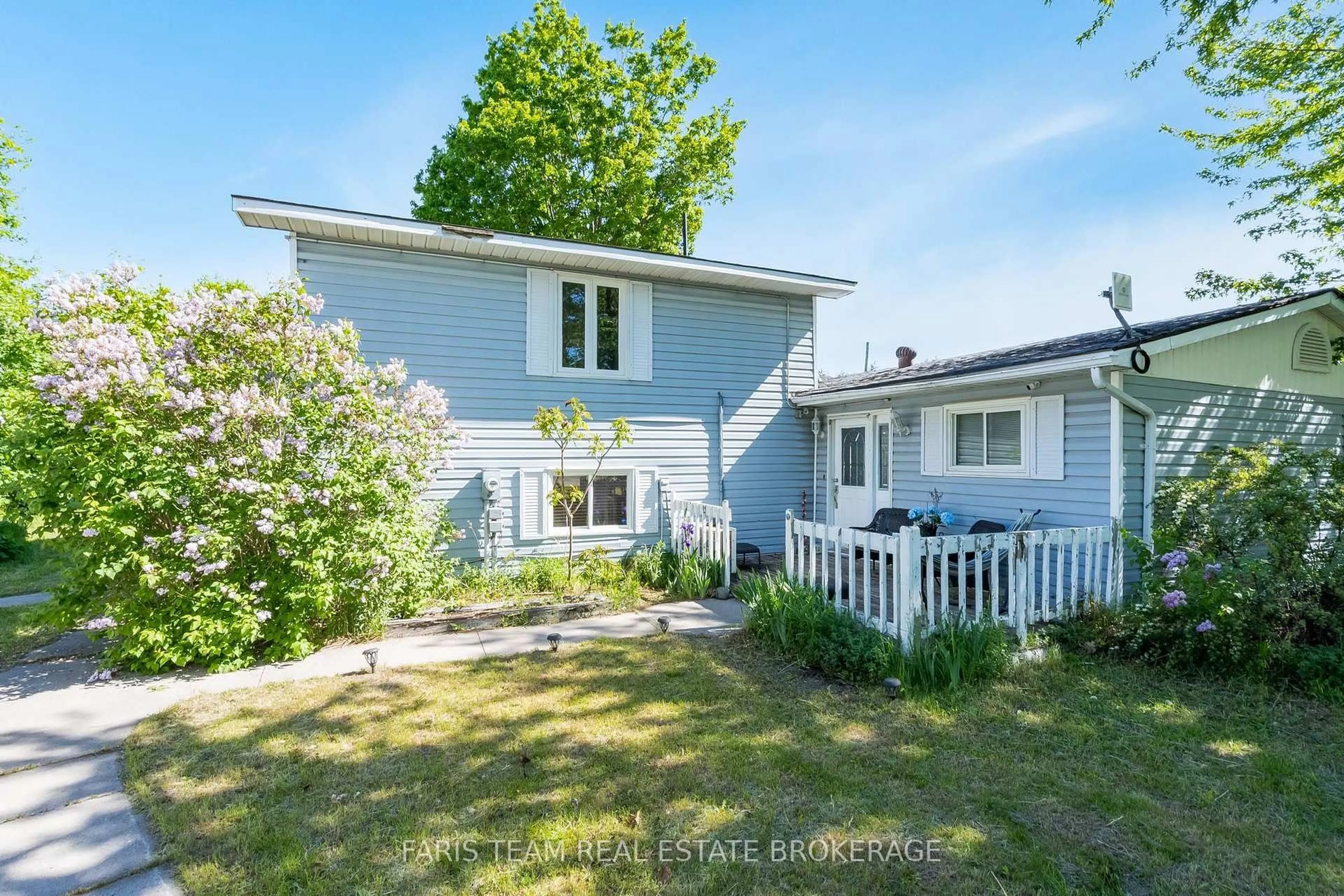 A pic from outside/outdoor area/front of a property/back of a property/a pic from drone, street for 1008 Rainbow Valley Rd, Springwater Ontario L0L 2K0