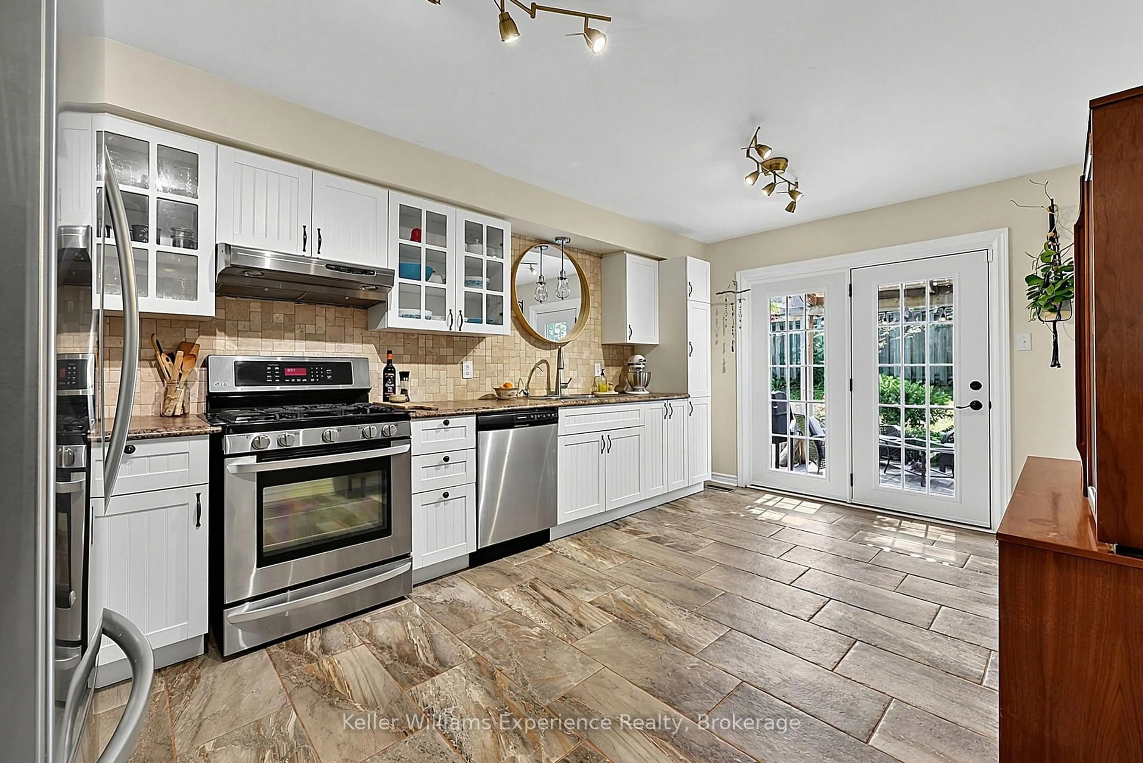 Open concept kitchen, ceramic/tile floor for 1044 Dina Cres, Midland Ontario L4R 5C5
