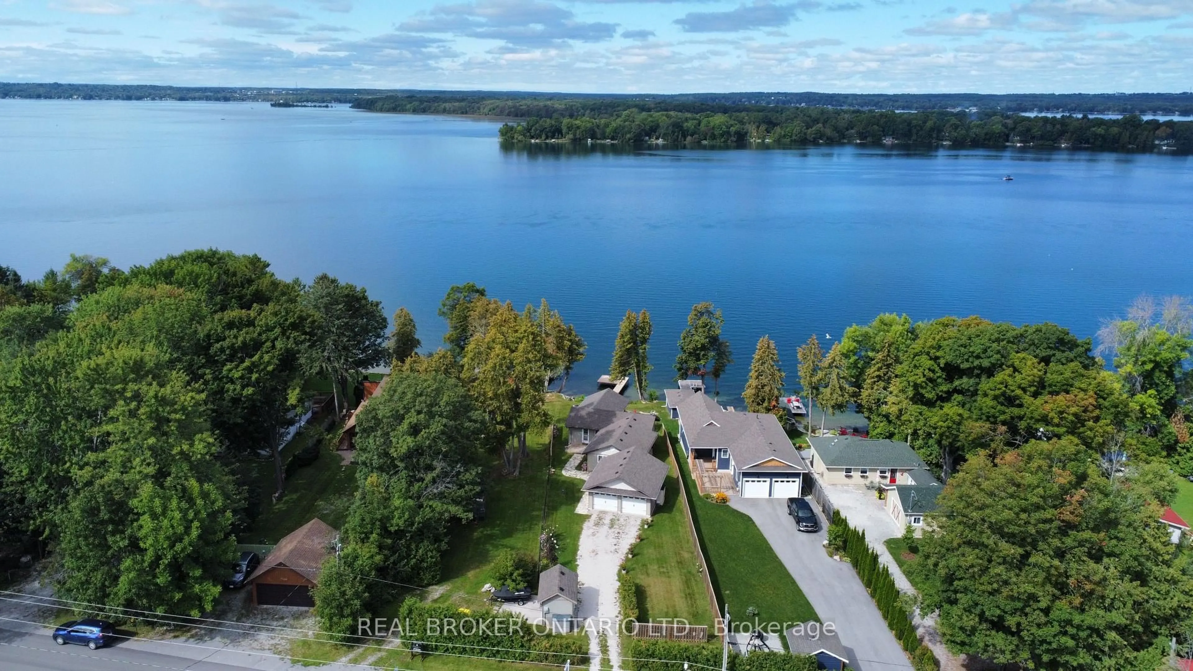 A pic from outside/outdoor area/front of a property/back of a property/a pic from drone, water/lake/river/ocean view for 5818 Victoria Park Rd, Ramara Ontario L3V 0T3