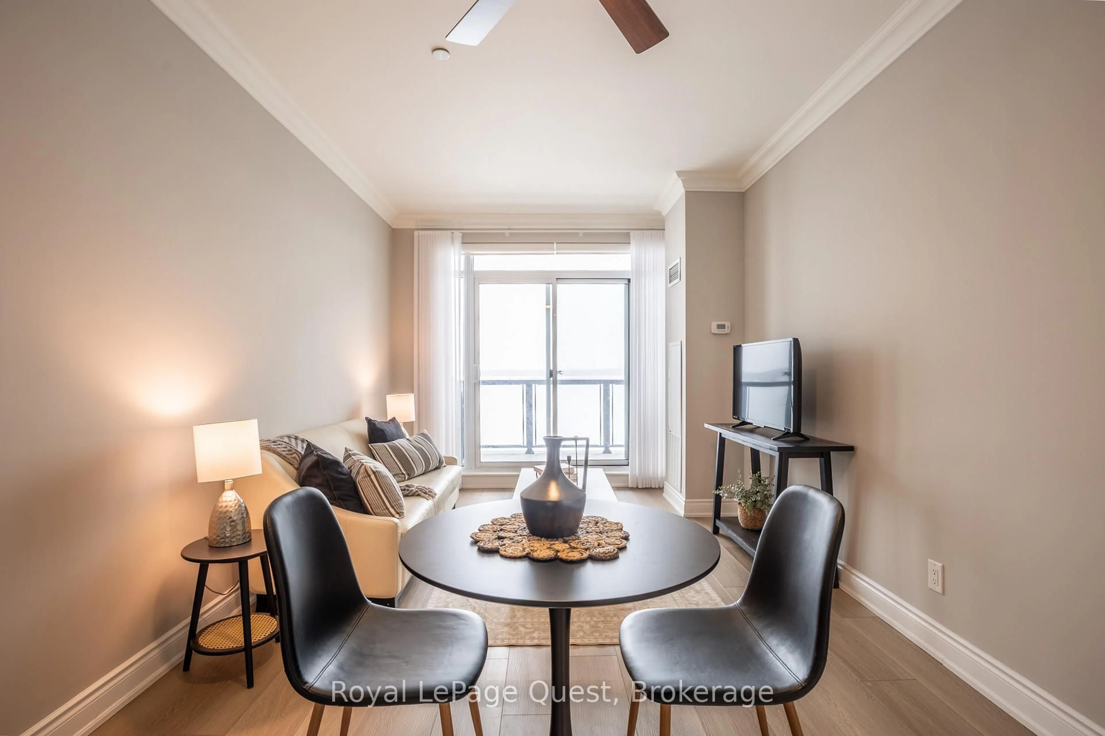 Living room with furniture, wood/laminate floor for 90 Orchard Pt #311, Orillia Ontario L3V 8K4