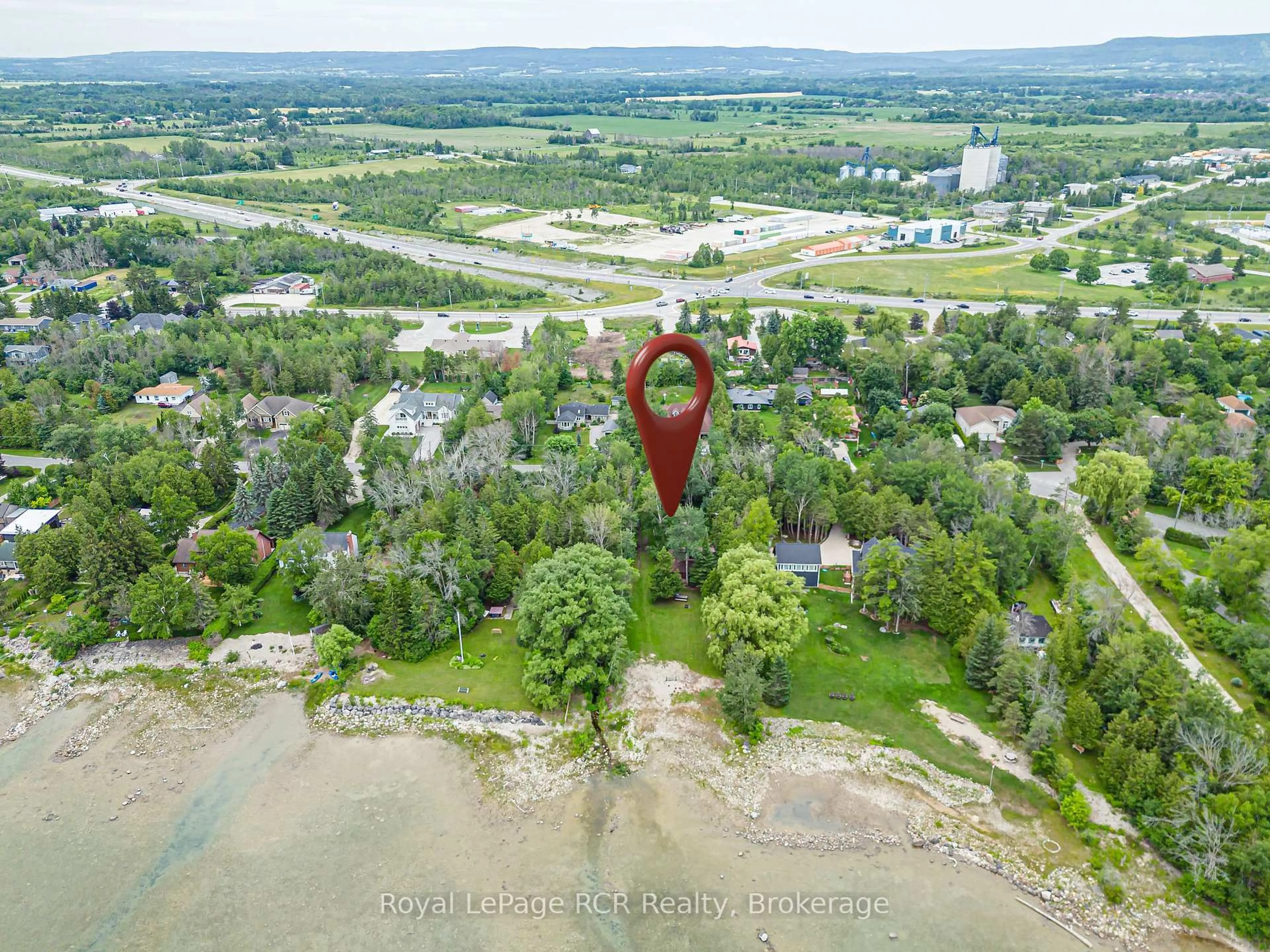 A pic from outside/outdoor area/front of a property/back of a property/a pic from drone, water/lake/river/ocean view for 35 Georgian Manor Dr, Collingwood Ontario L9Y 5P2