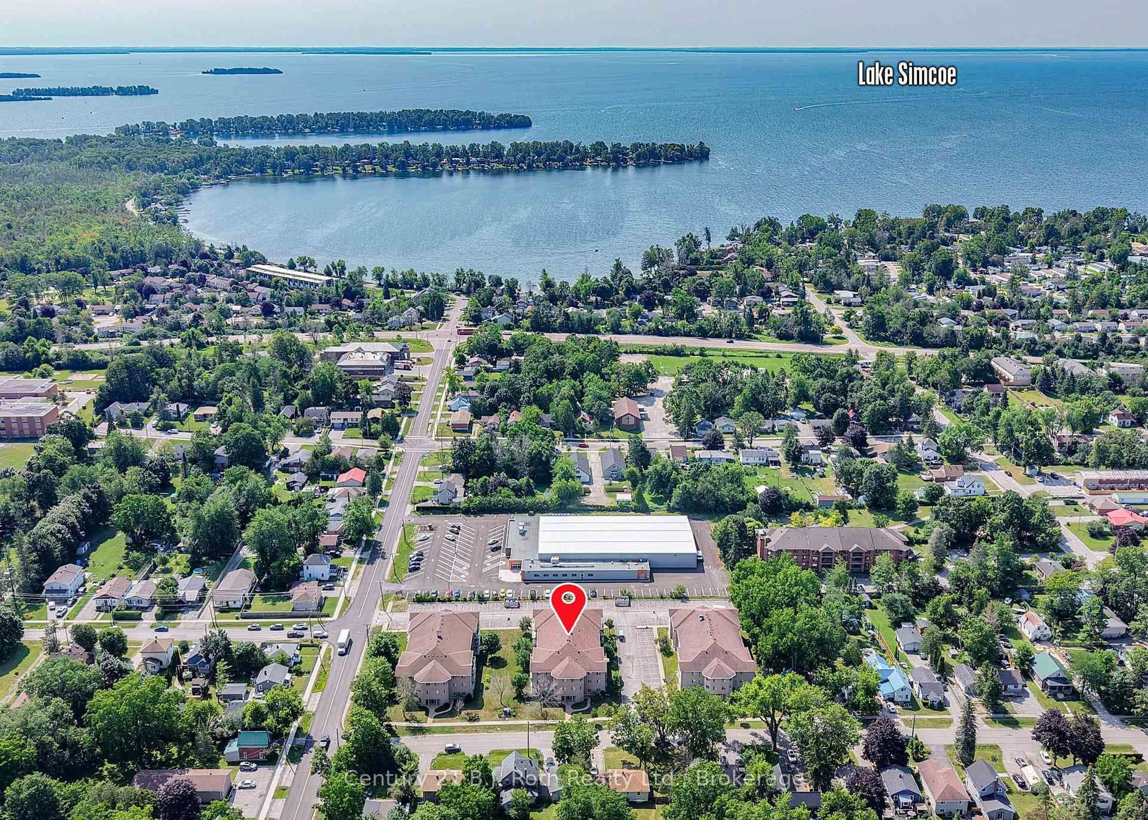 A pic from outside/outdoor area/front of a property/back of a property/a pic from drone, water/lake/river/ocean view for 115 Bond St #Unit 201, Orillia Ontario L3V 1J7