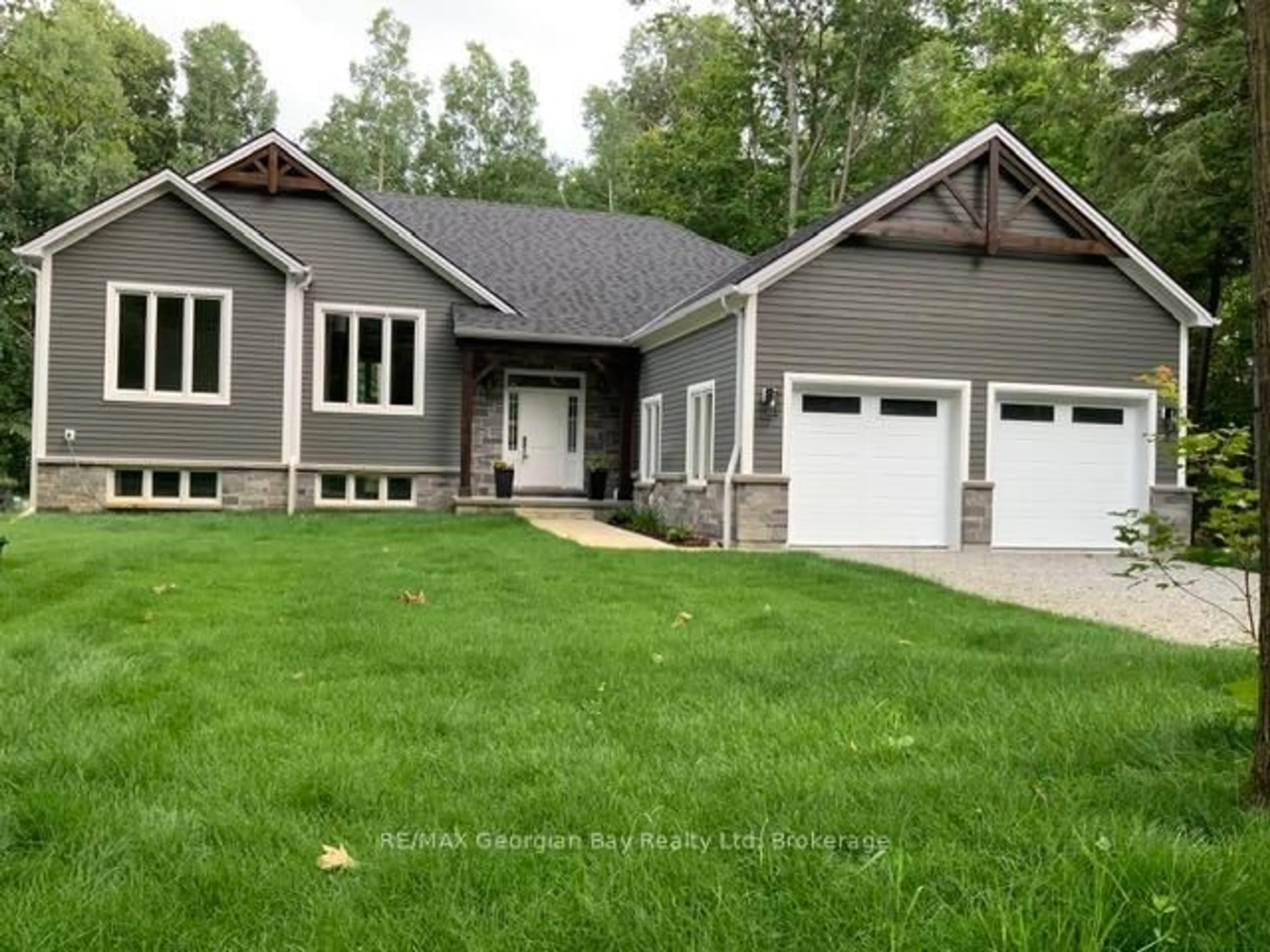 Home with vinyl exterior material, street for 5 Oakwood Ave, Tiny Ontario L9M 0J2