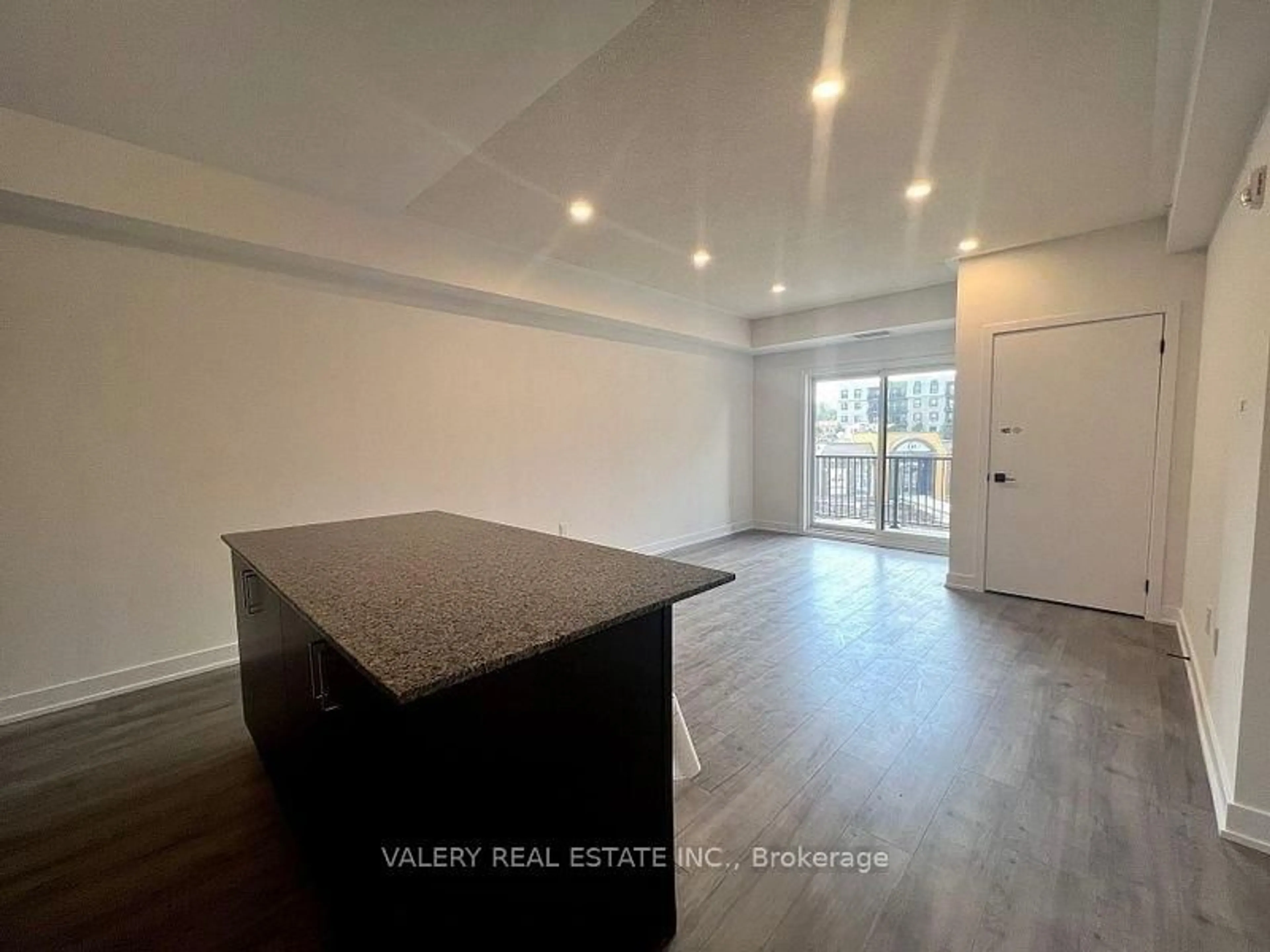 Open concept kitchen, wood/laminate floor for 1 Chef Lane #205, Barrie Ontario L9J 0J8