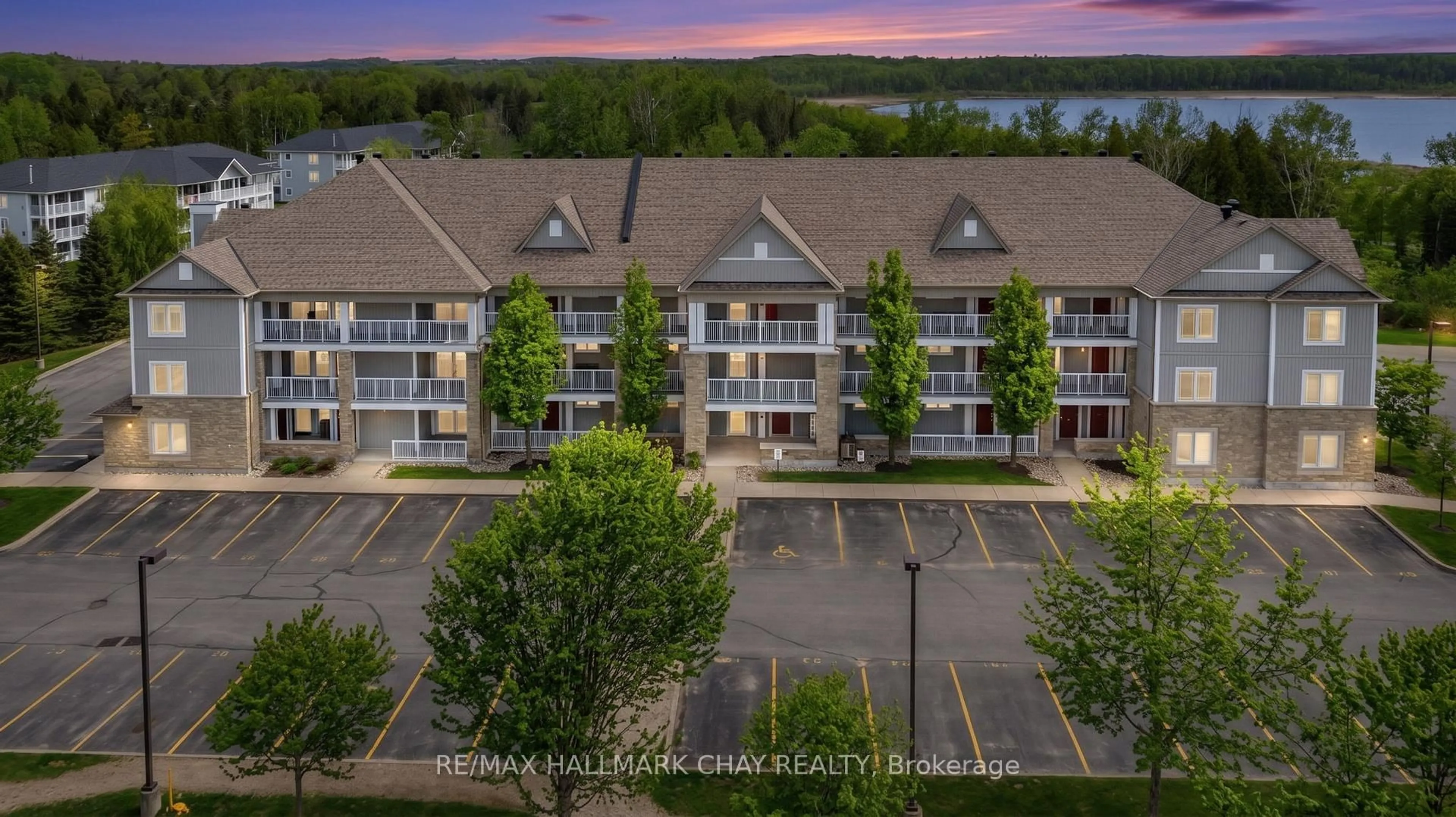 A pic from outside/outdoor area/front of a property/back of a property/a pic from drone, water/lake/river/ocean view for 40 Mulligan Lane #307, Wasaga Beach Ontario L9Z 0C5
