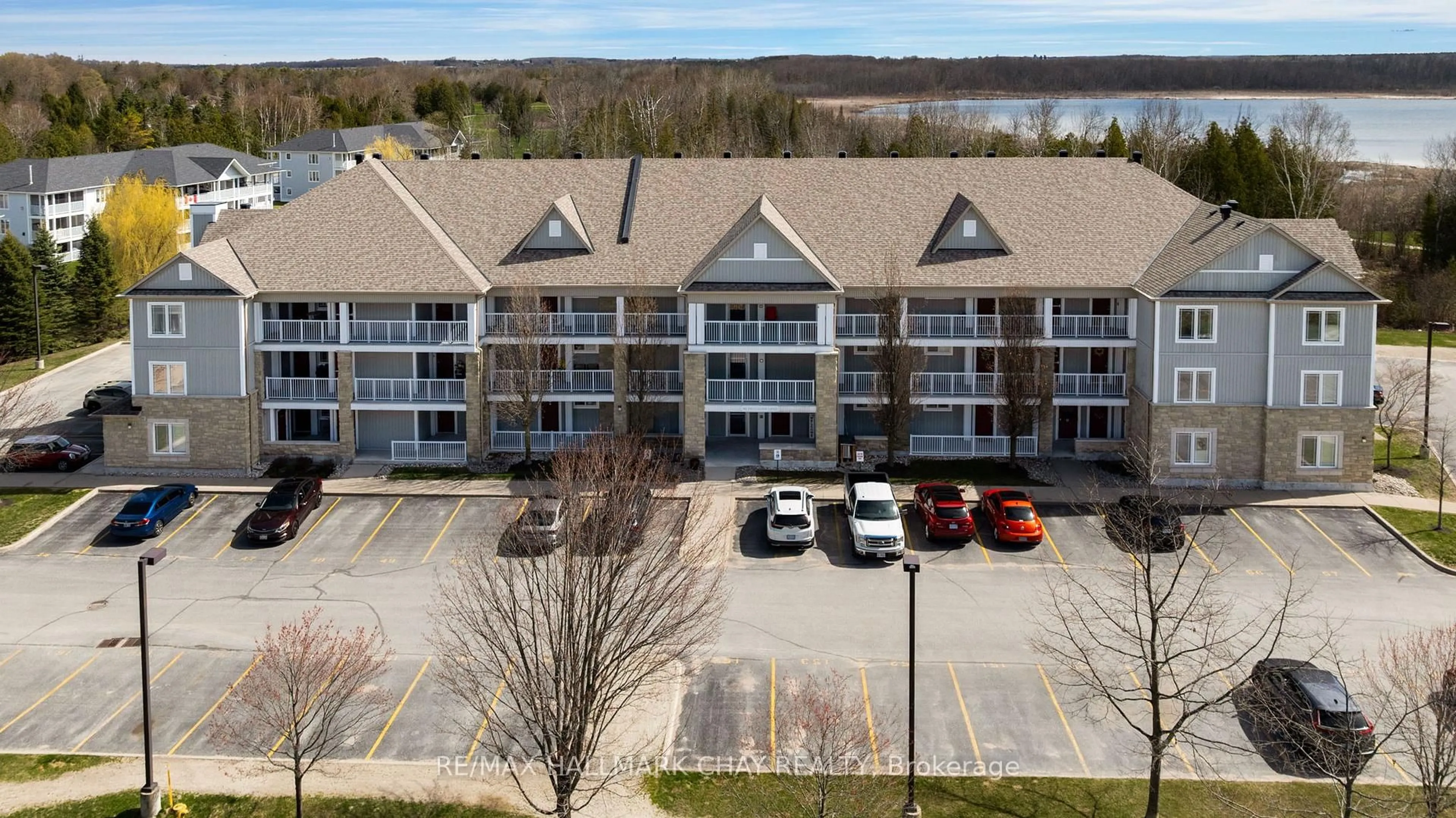 A pic from outside/outdoor area/front of a property/back of a property/a pic from drone, water/lake/river/ocean view for 40 Mulligan Lane #307, Wasaga Beach Ontario L9Z 0C5