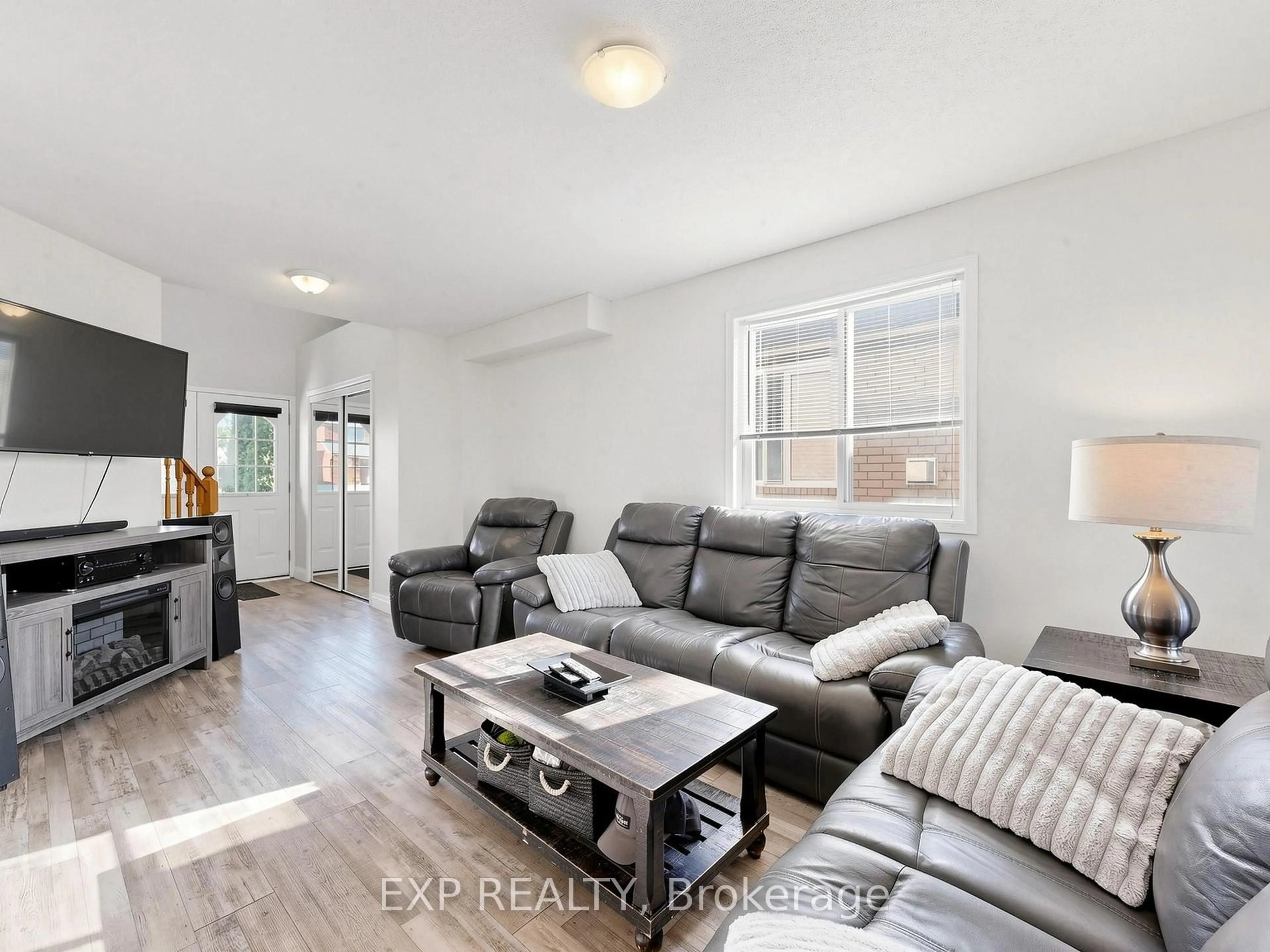 Living room with furniture, wood/laminate floor for 6 Booth Lane, Barrie Ontario L4N 0S4