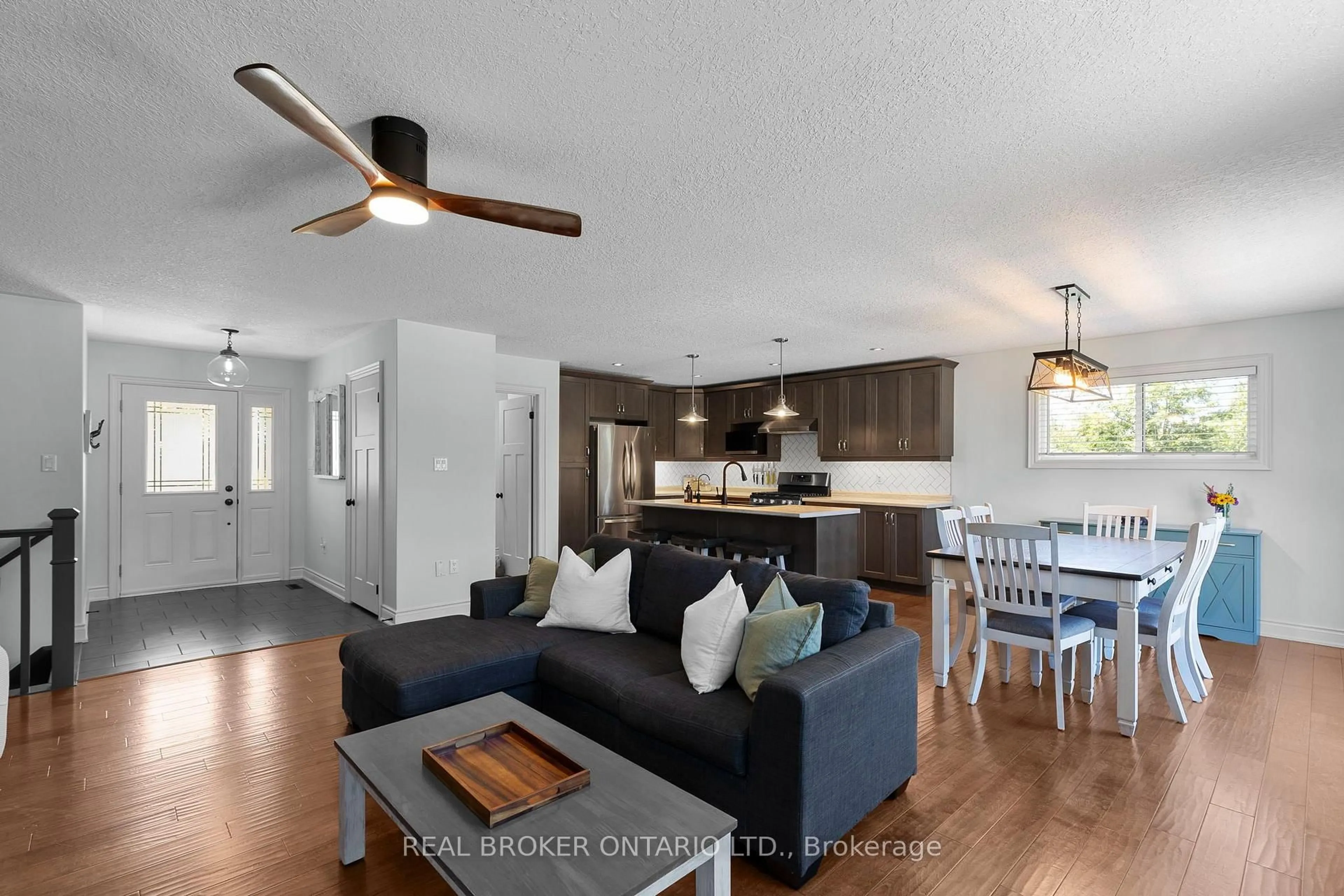 Open concept kitchen, wood/laminate floor for 34 Merrington Ave, Oro-Medonte Ontario L3V 0R5
