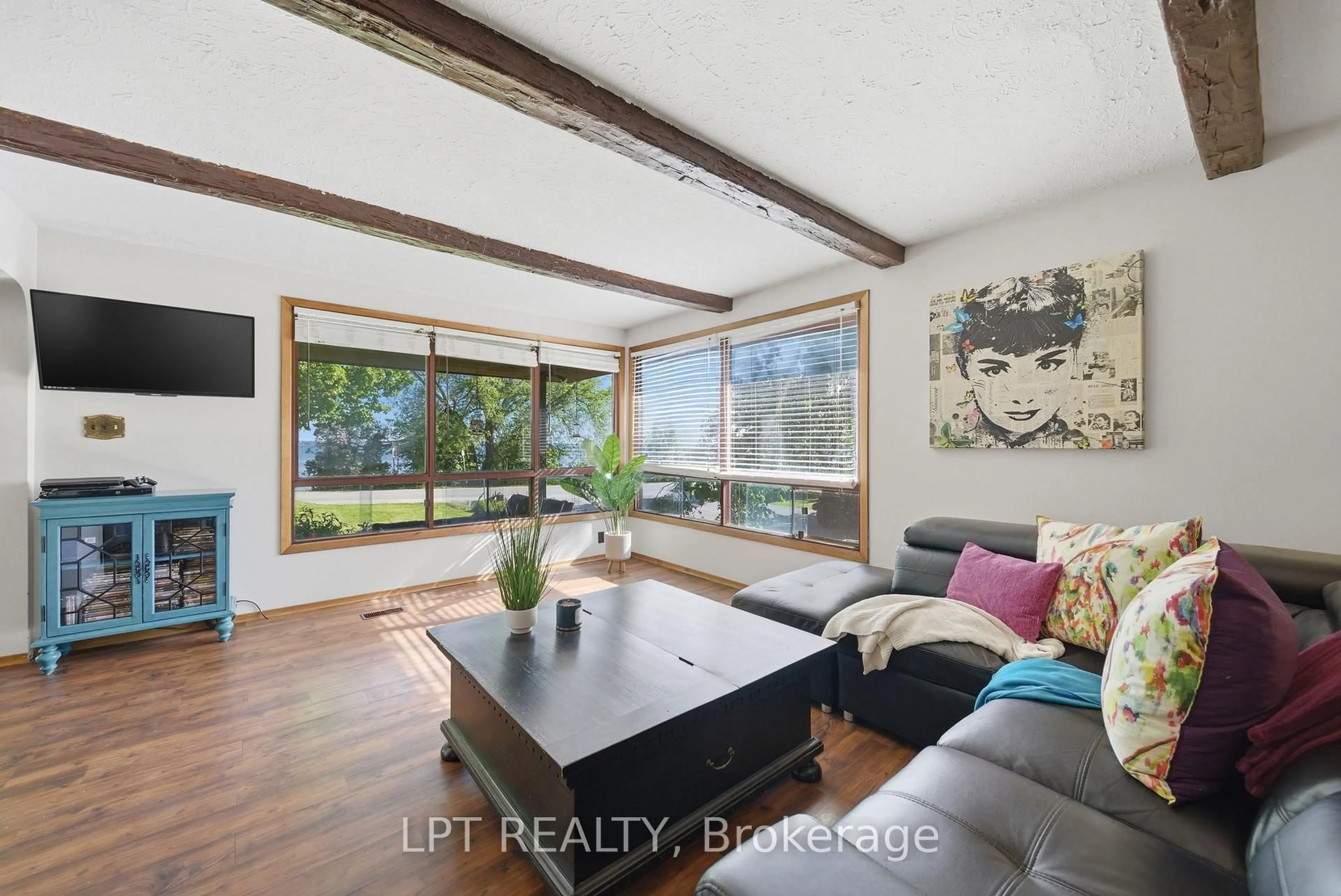 Living room with furniture, wood/laminate floor for 1293 Ramara Road 47 Rd, Ramara Ontario L0K 1B0