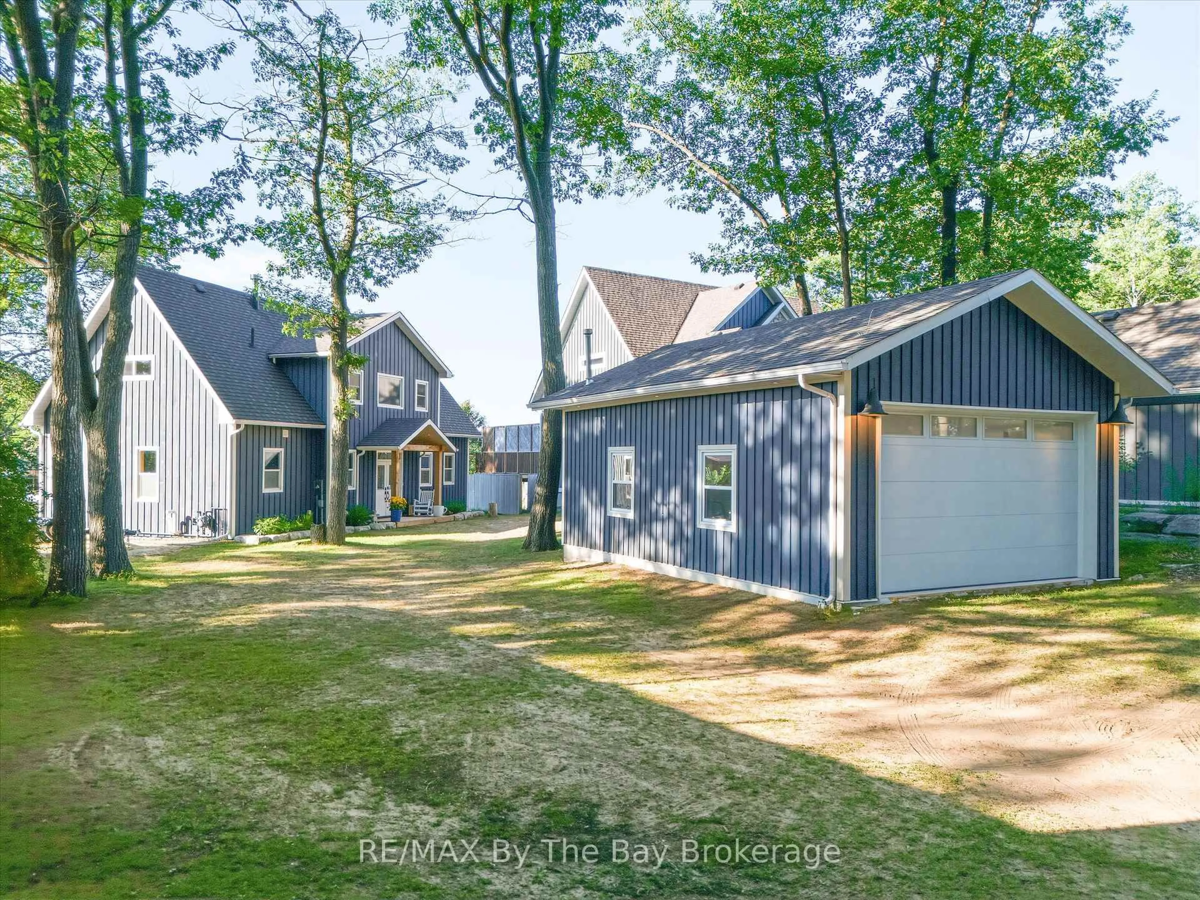 A pic from outside/outdoor area/front of a property/back of a property/a pic from drone, street for 2056 River Rd, Wasaga Beach Ontario L9Z 2W1