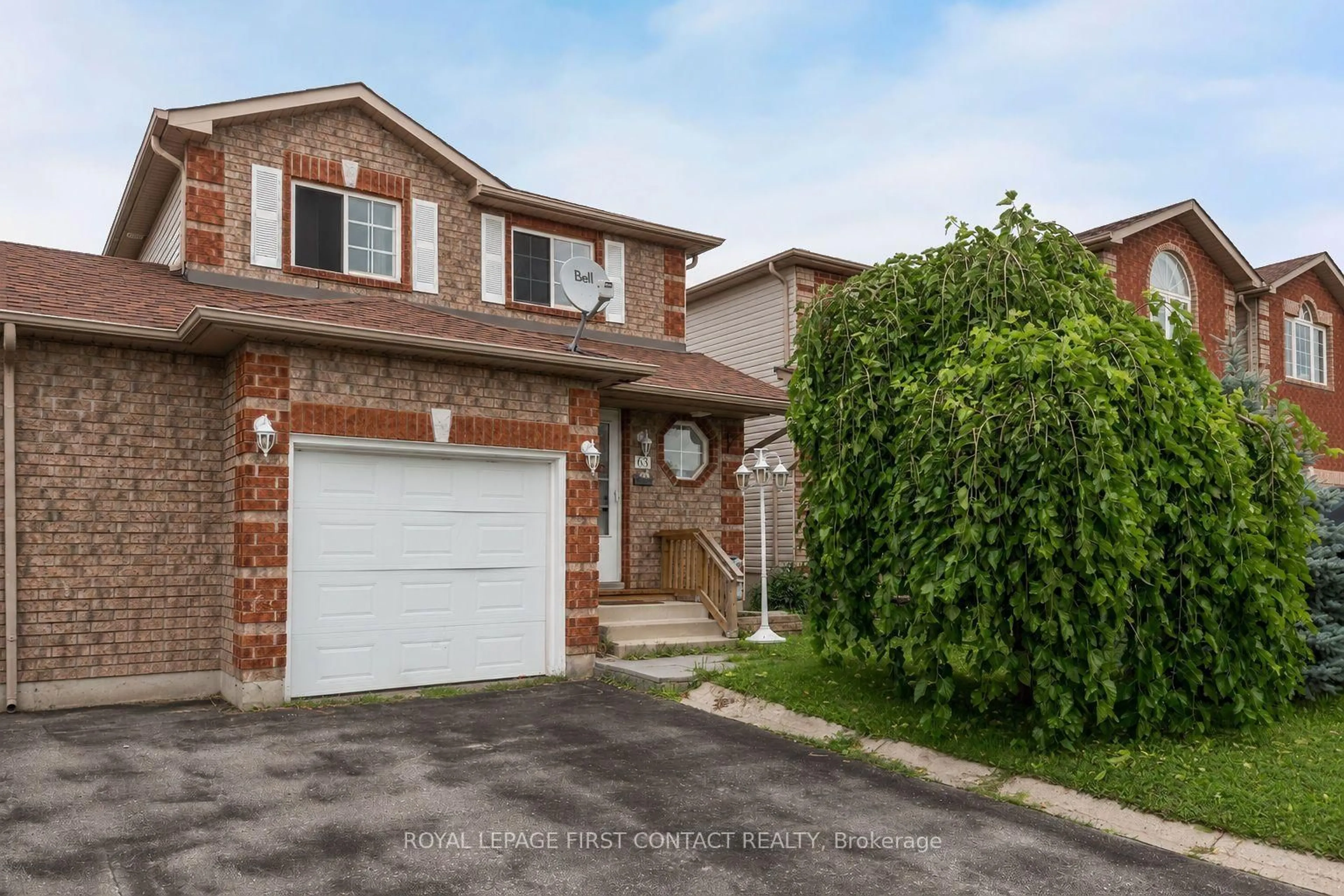 Home with brick exterior material, street for 63 Dunsmore Lane, Barrie Ontario L4M 6Z9