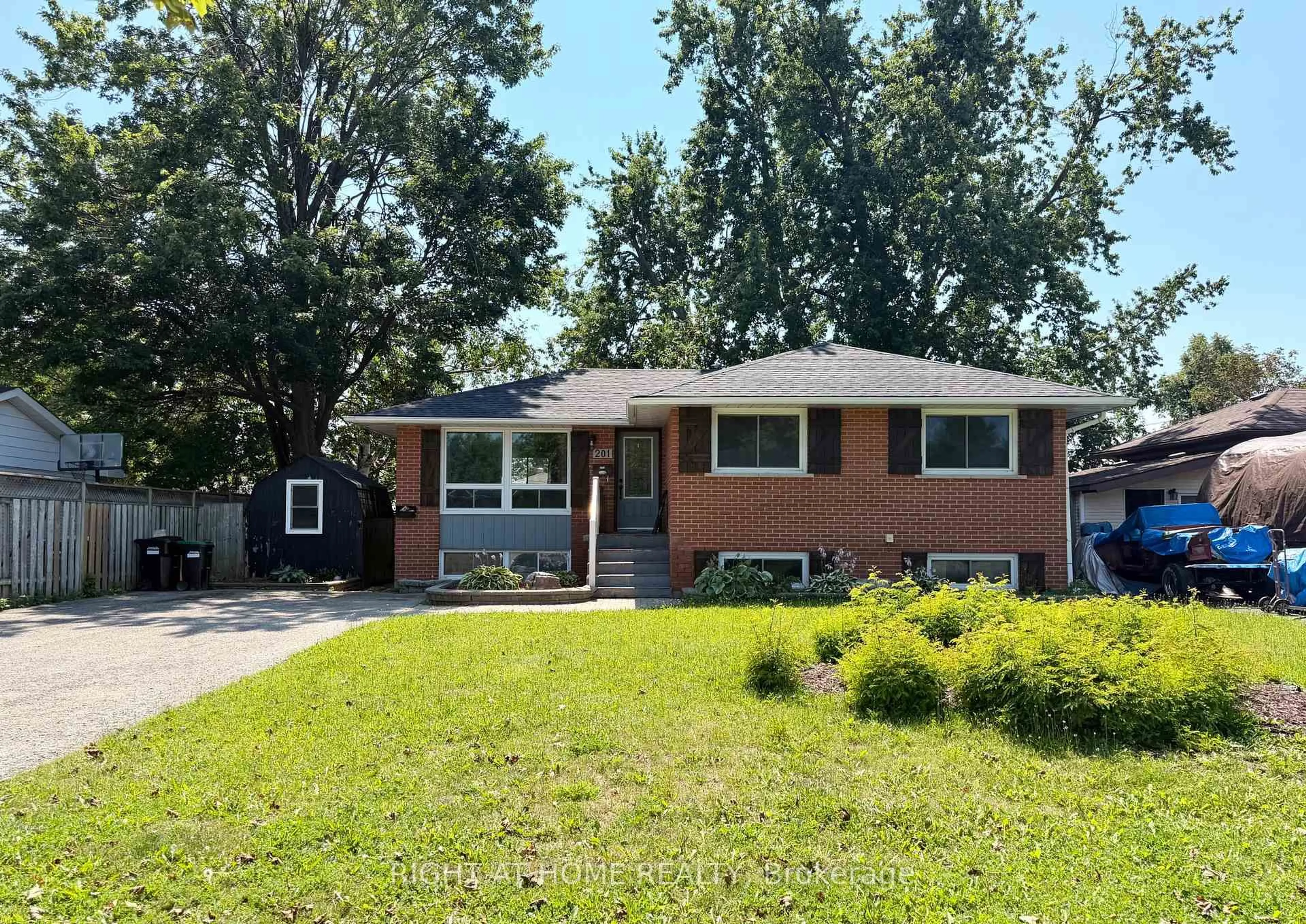 Home with brick exterior material, street for 201 Steel St, Barrie Ontario L4M 2G8
