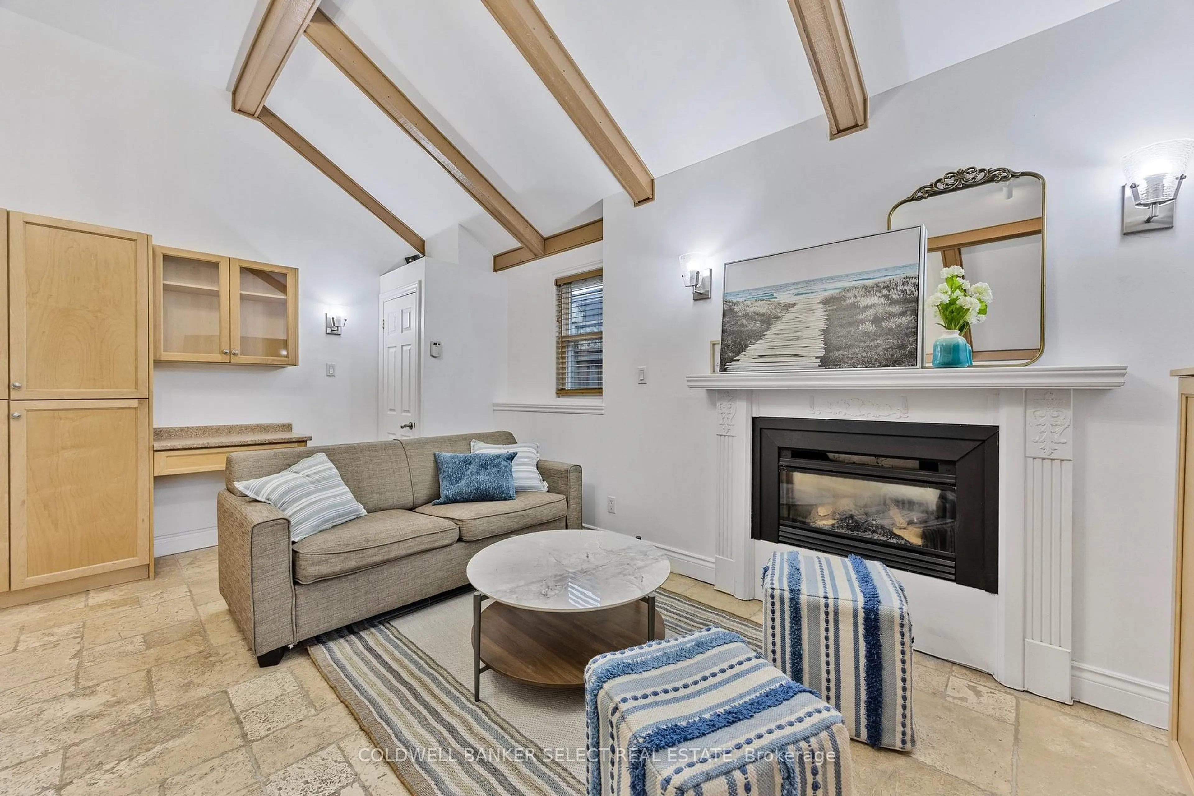 Living room with furniture, ceramic/tile floor for 77-79 Baker St, Wasaga Beach Ontario L9Z 2G7