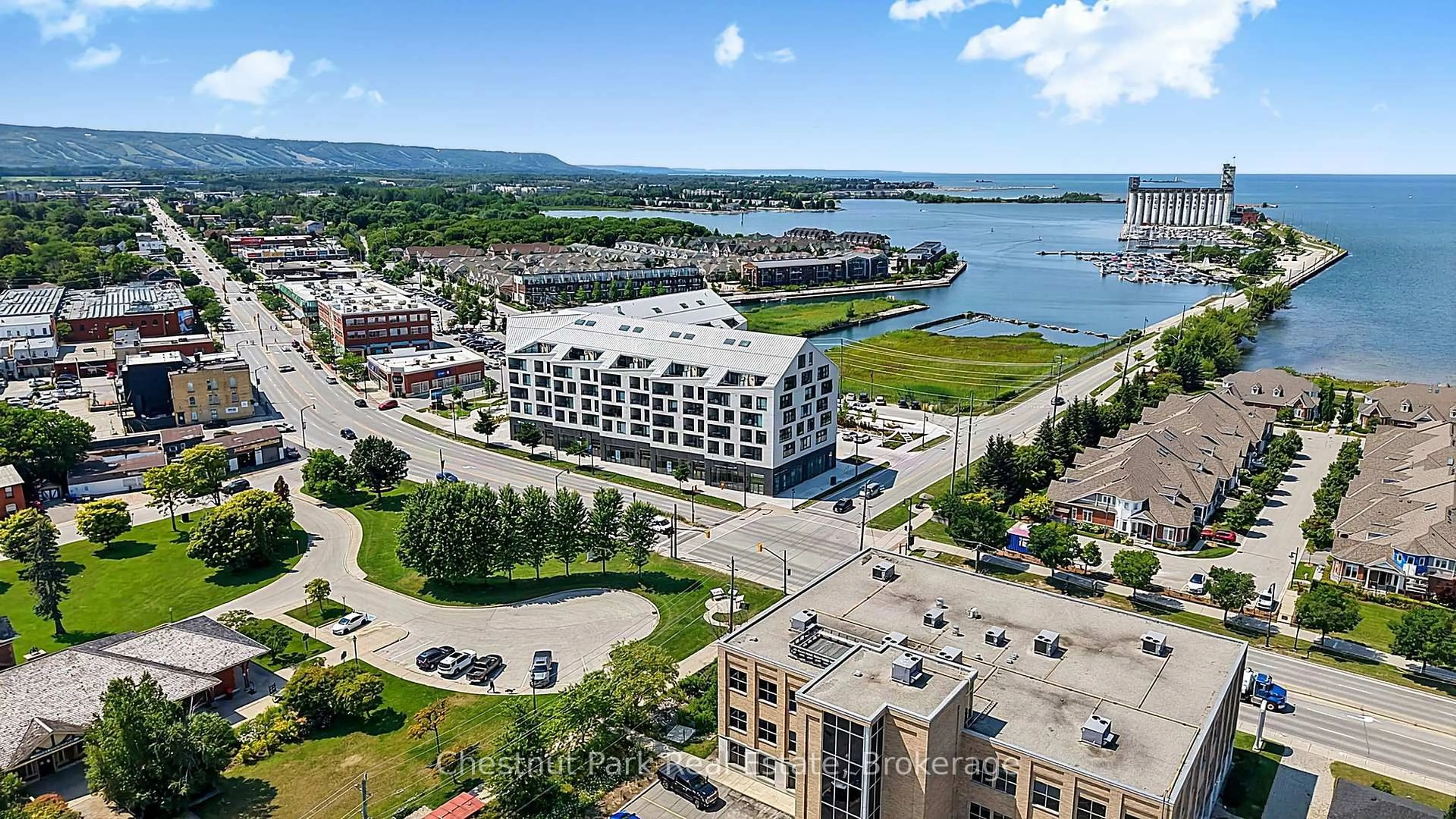 A pic from outside/outdoor area/front of a property/back of a property/a pic from drone, water/lake/river/ocean view for 31 Huron St #618, Collingwood Ontario L9Y 5T7