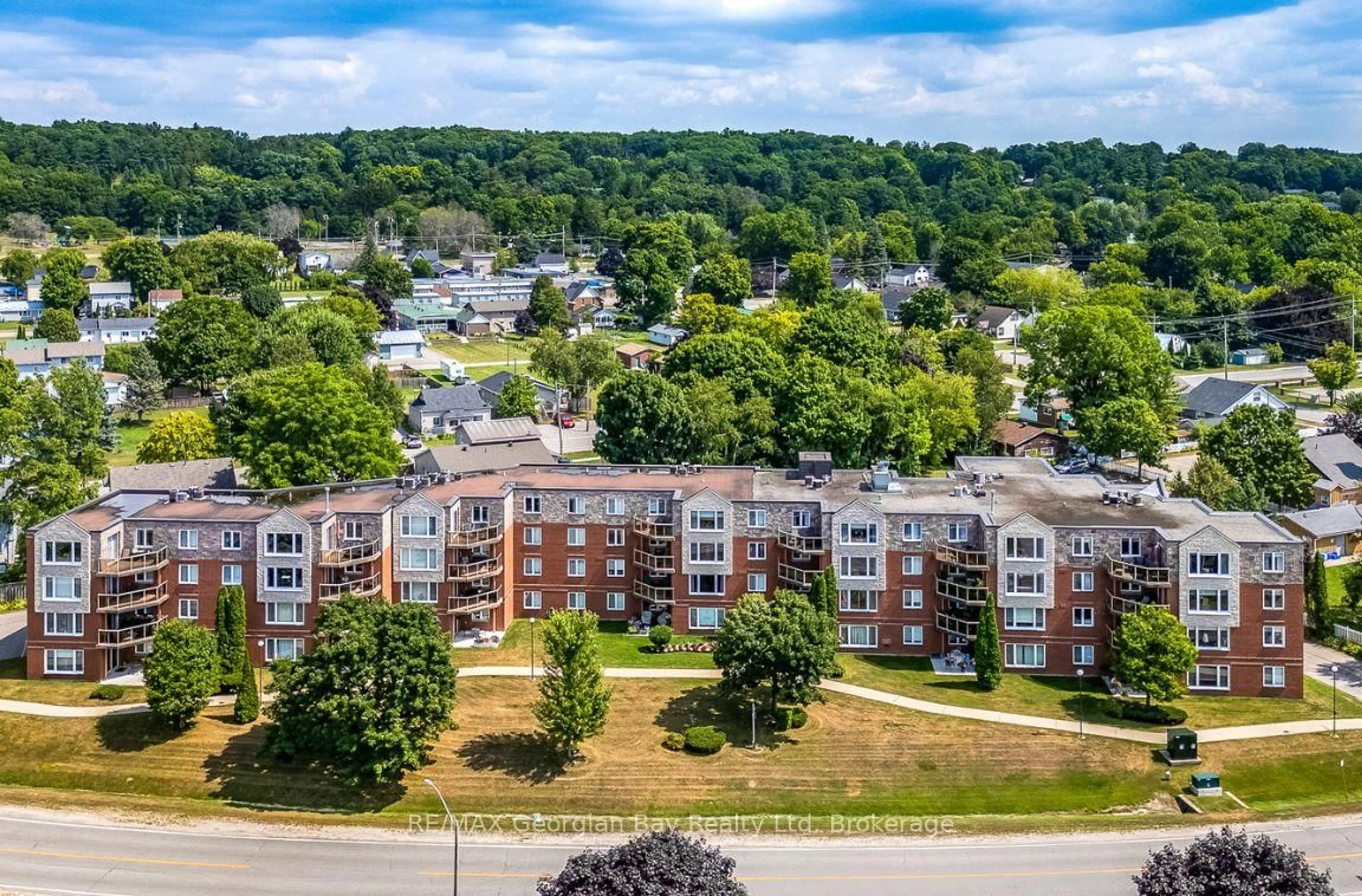A pic from outside/outdoor area/front of a property/back of a property/a pic from drone, city buildings view from balcony for 11 Beck Blvd #404, Penetanguishene Ontario L9M 2G1