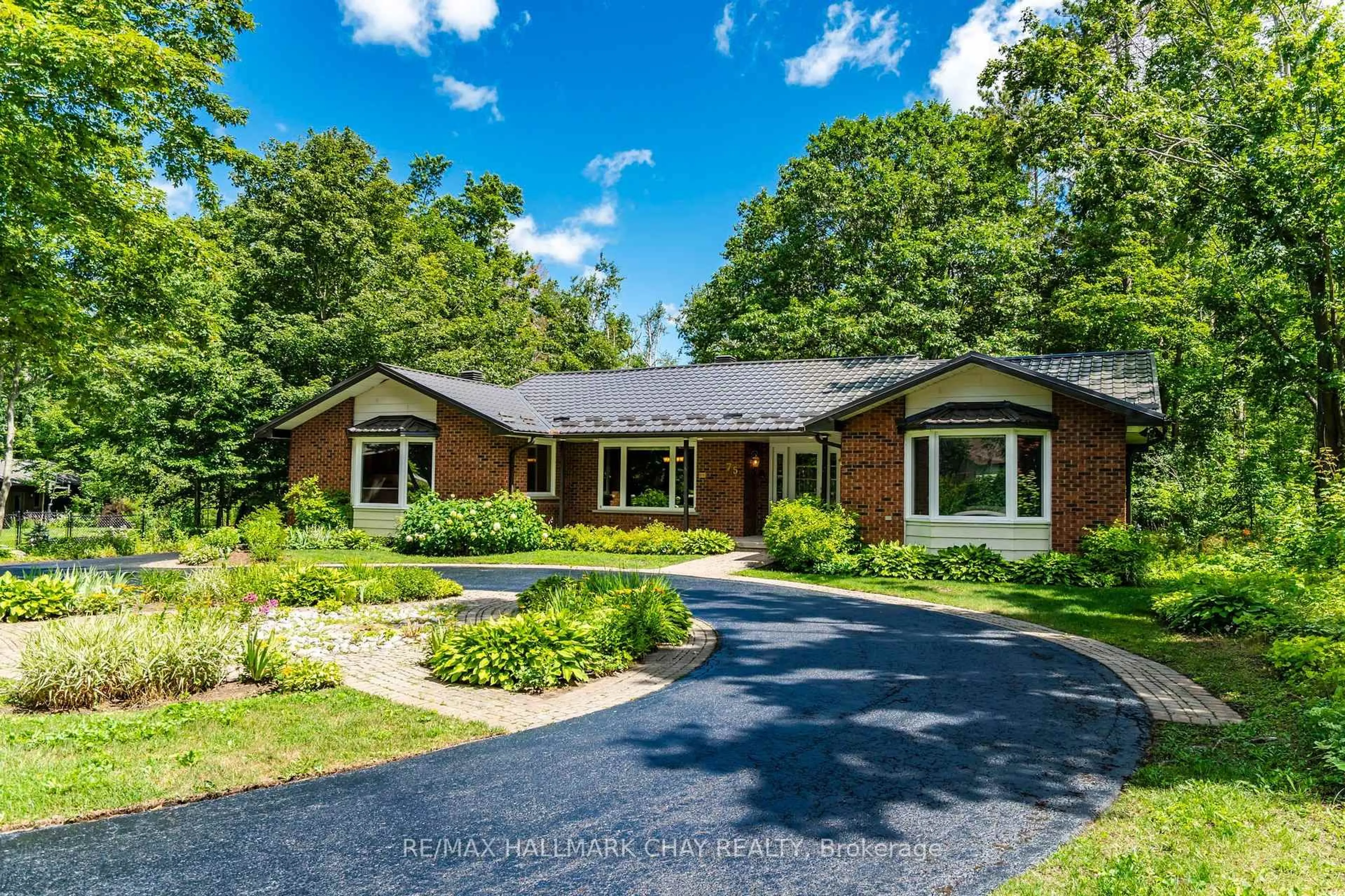 Home with brick exterior material, street for 75 Cathedral Pines Rd, Oro-Medonte Ontario L4M 4Y8