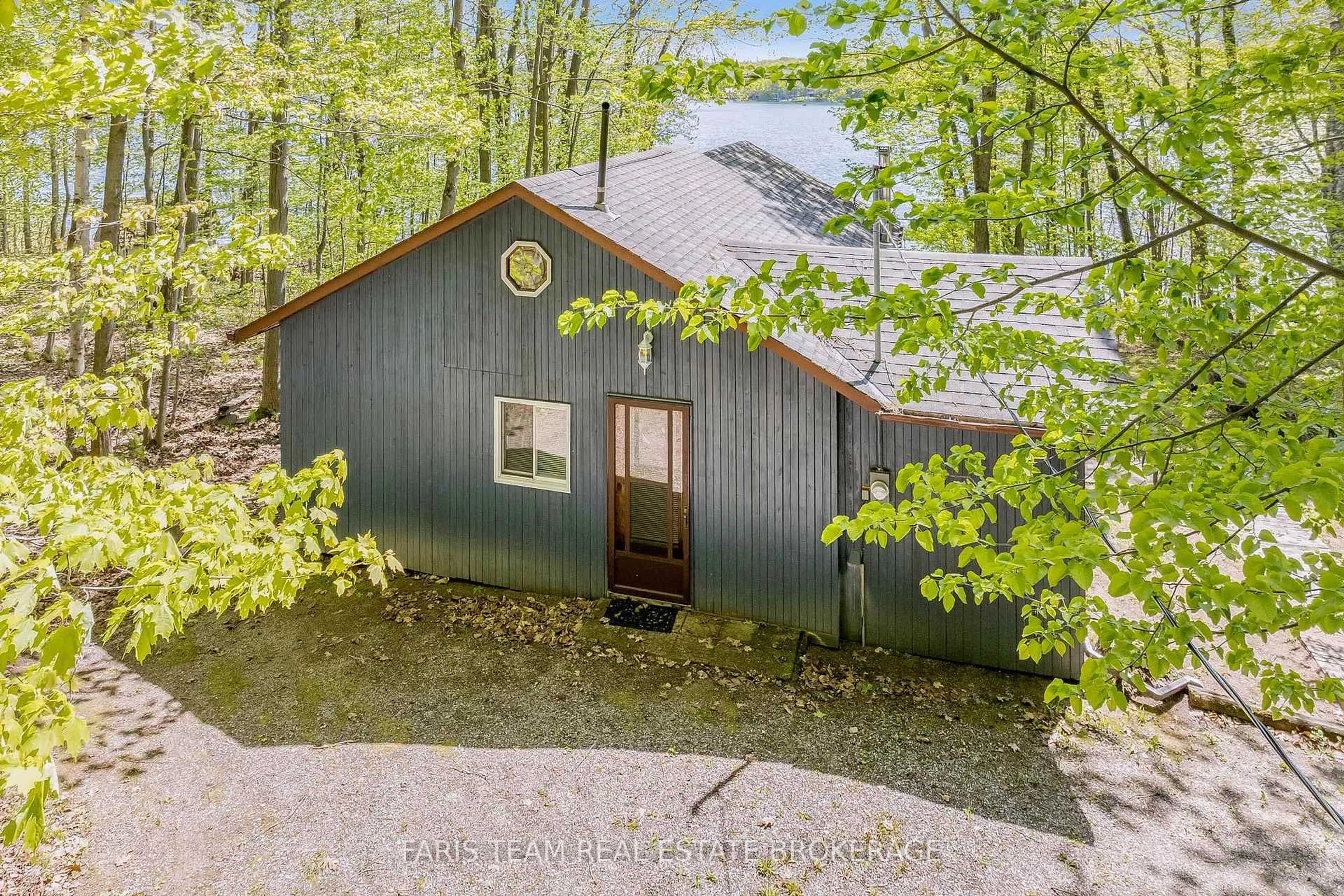 A pic from outside/outdoor area/front of a property/back of a property/a pic from drone, forest/trees view for 112 Farlain Lake Rd, Tiny Ontario L9M 0B5