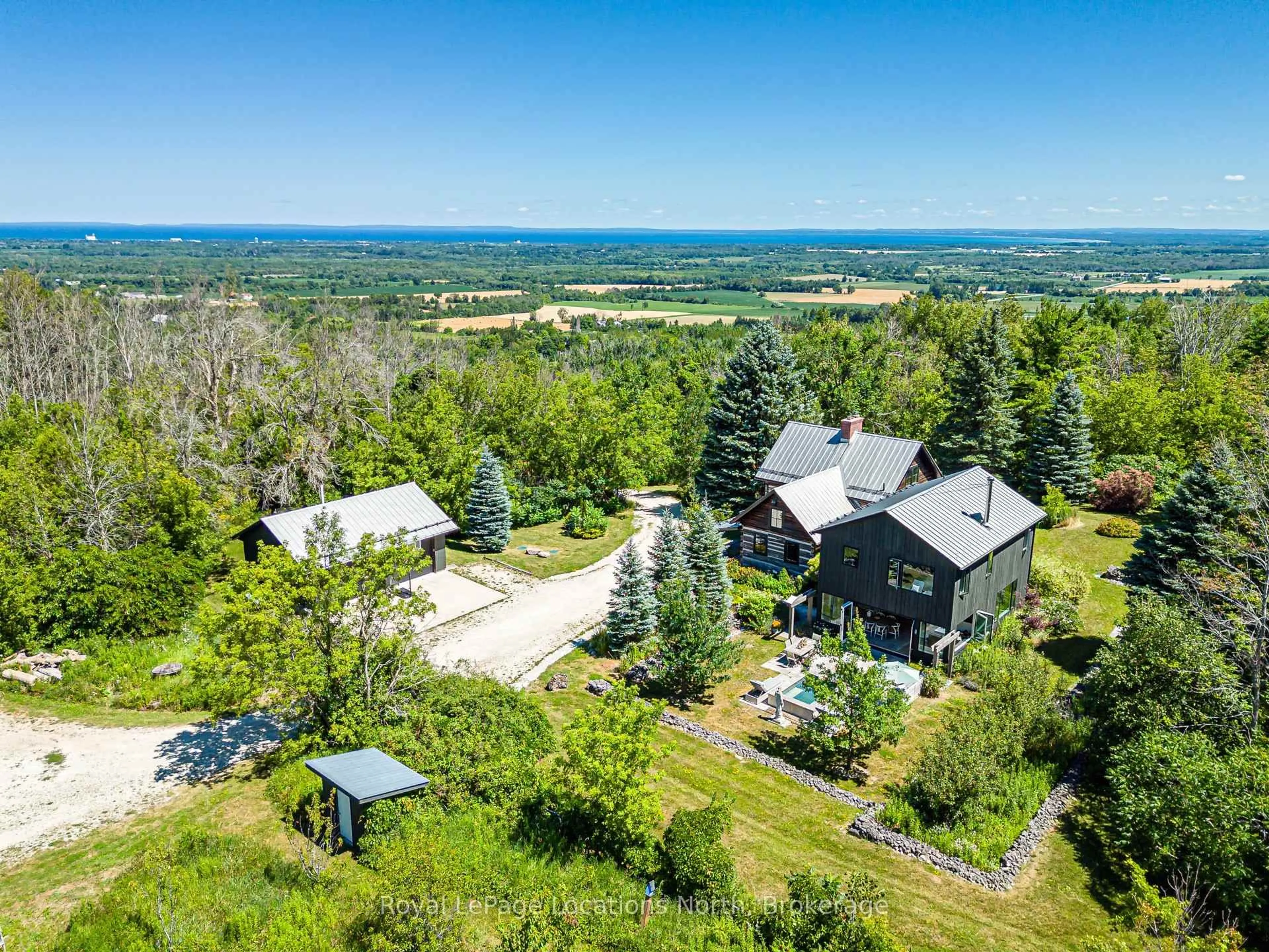 A pic from outside/outdoor area/front of a property/back of a property/a pic from drone, mountain view for 1664 10 Concession, Clearview Ontario L0M 1H0
