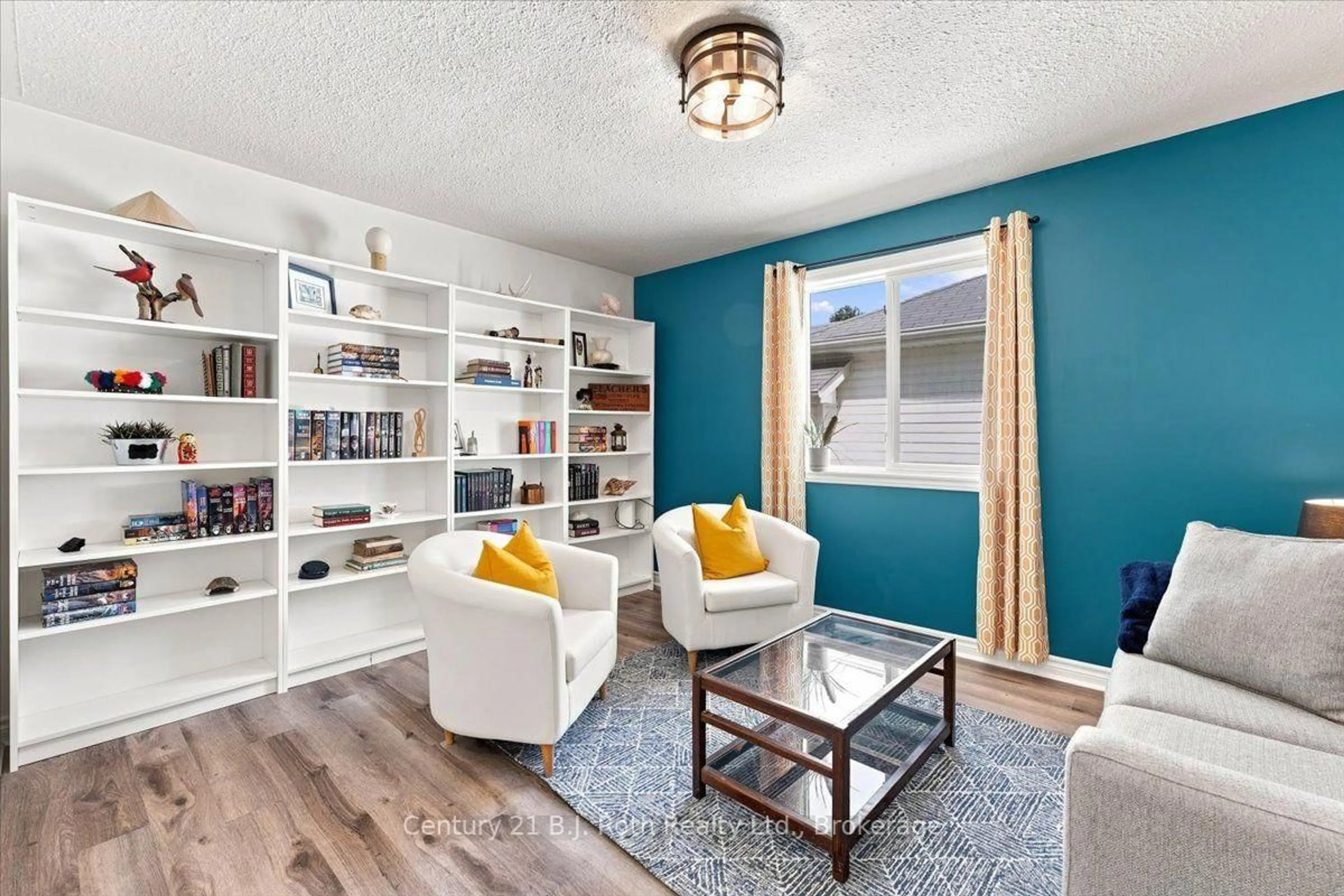 Living room with furniture, wood/laminate floor for 413 Irwin St, Midland Ontario L4R 2V6