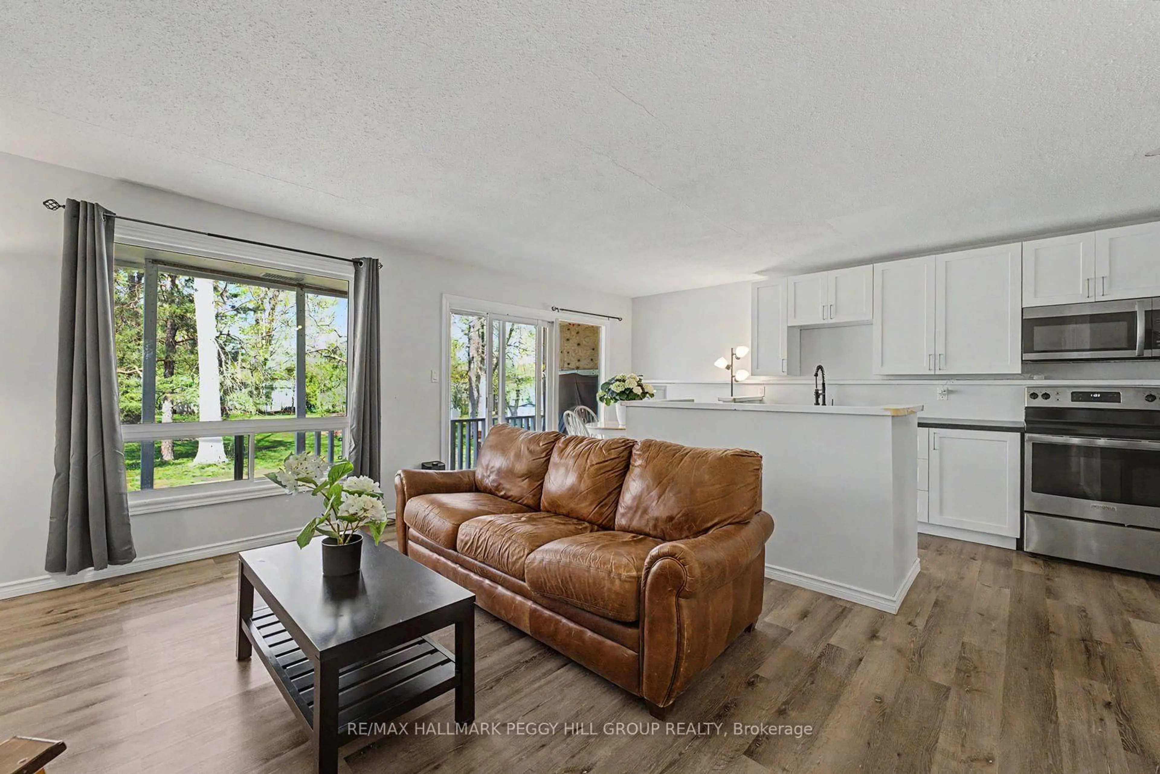 Living room with furniture, wood/laminate floor for 22 Olive Cres, Orillia Ontario L3V 1G1