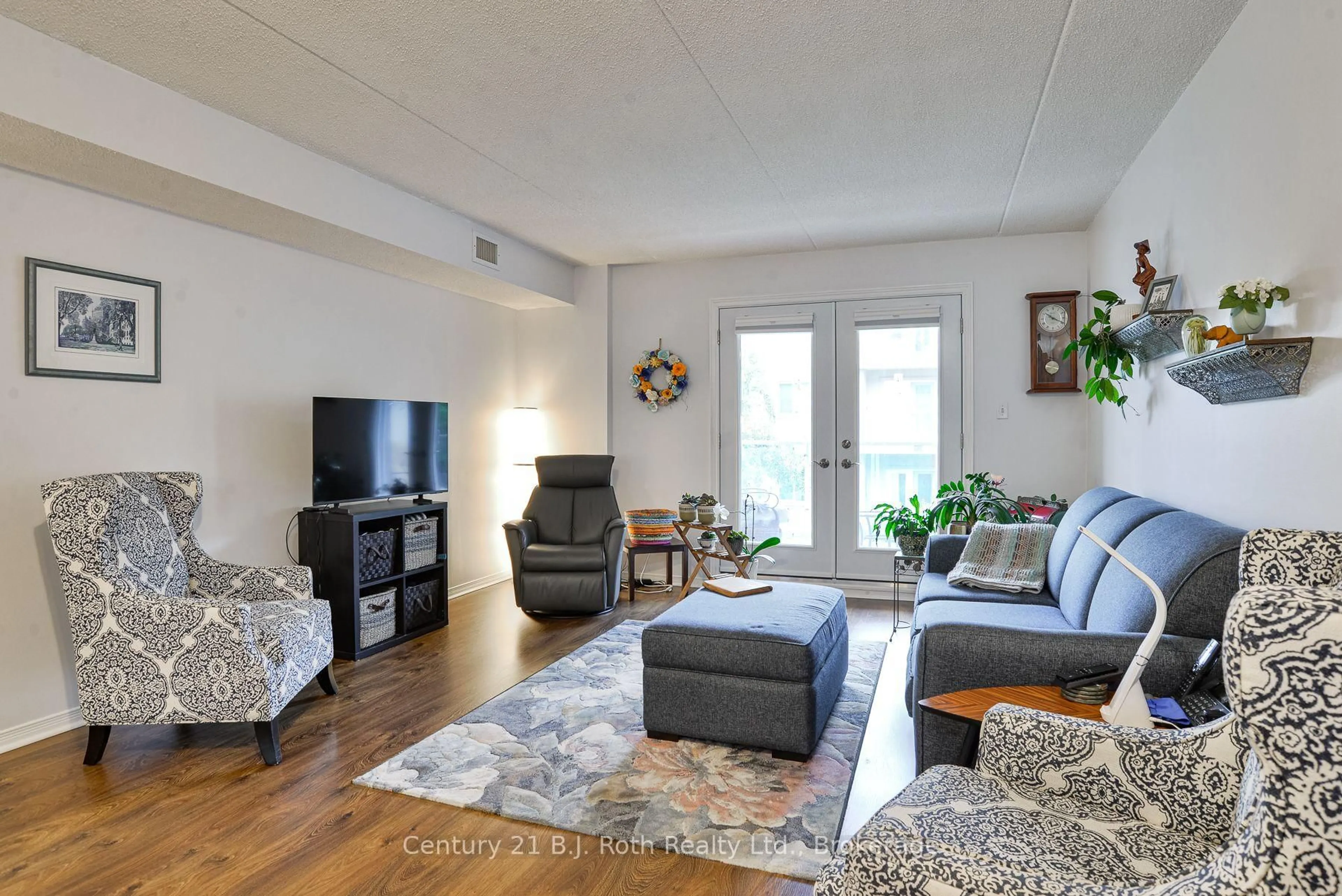 Living room with furniture, unknown for 125 Bond St #207, Orillia Ontario L3V 1J7