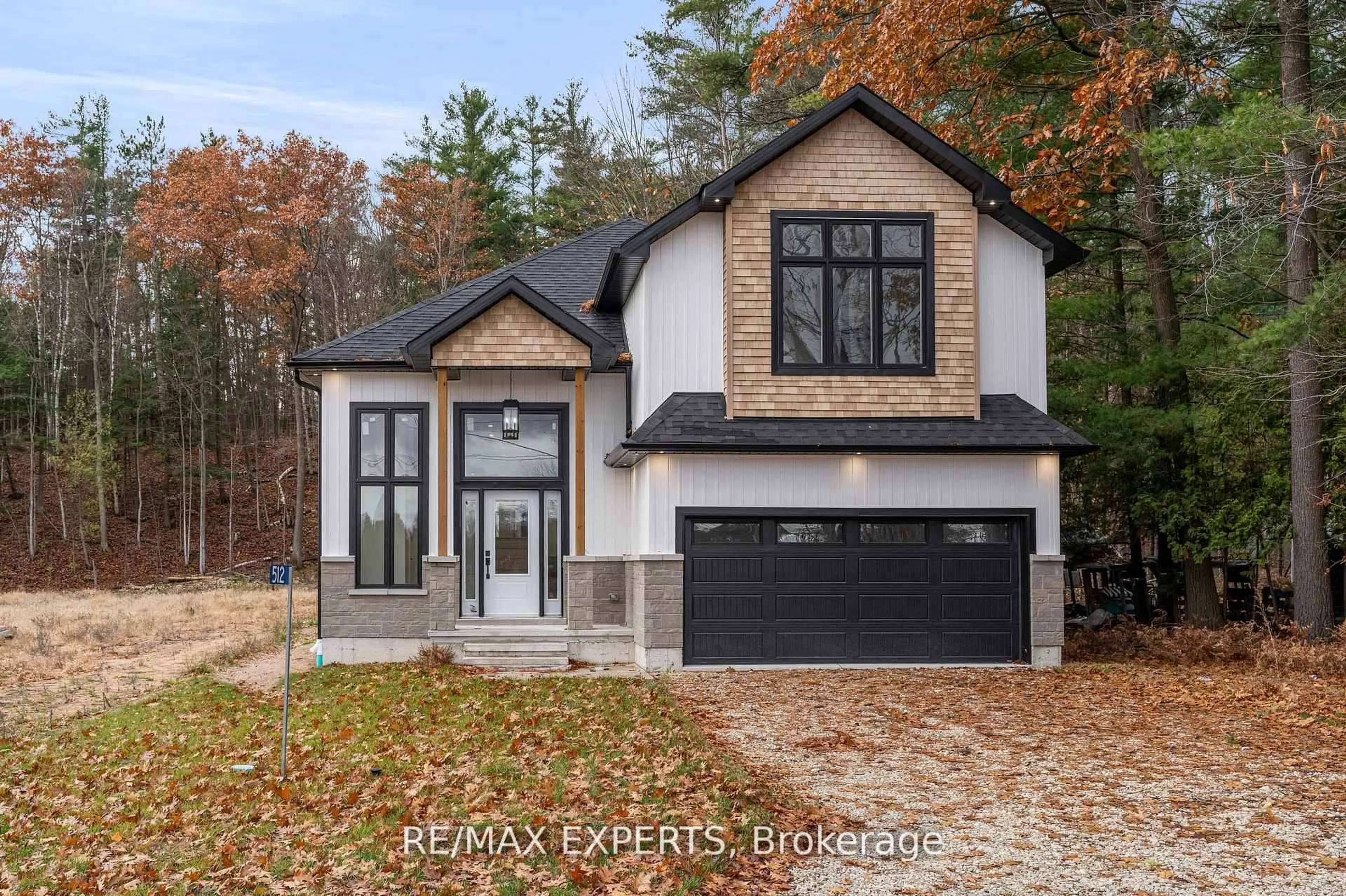 Home with brick exterior material, street for 506 Golf Course Rd, Wasaga Beach Ontario L9Z 1S5