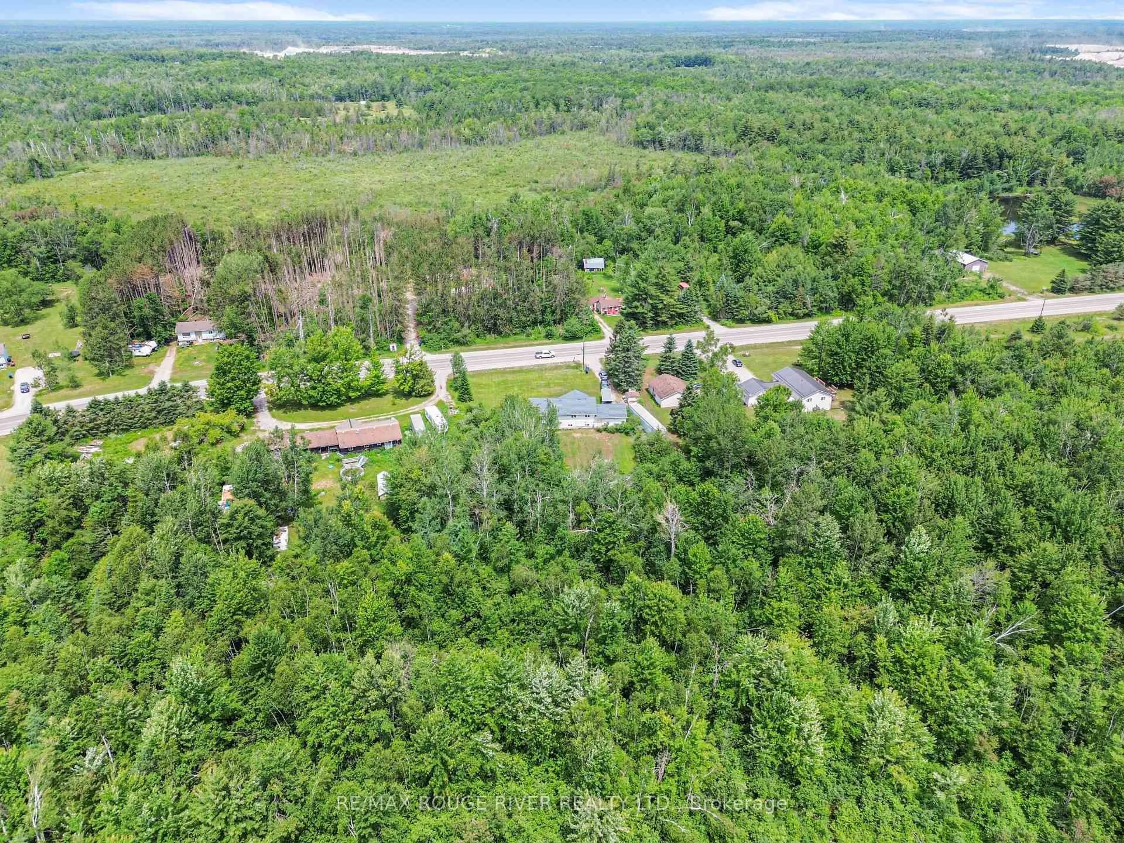 A pic from outside/outdoor area/front of a property/back of a property/a pic from drone, forest/trees view for 2225 Monck Rd, Ramara Ontario L3V 0P6