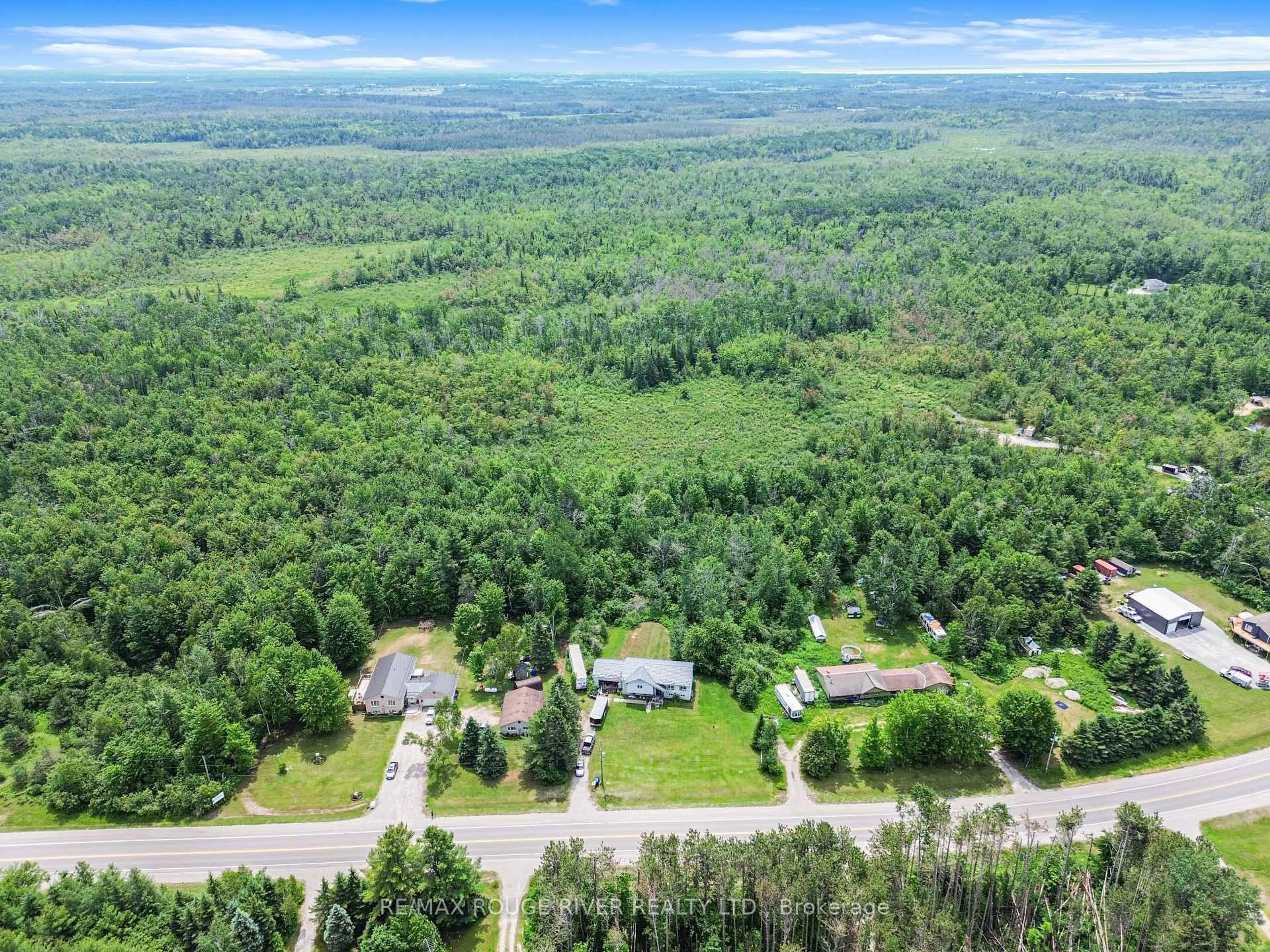 A pic from outside/outdoor area/front of a property/back of a property/a pic from drone, forest/trees view for 2225 Monck Rd, Ramara Ontario L3V 0P6