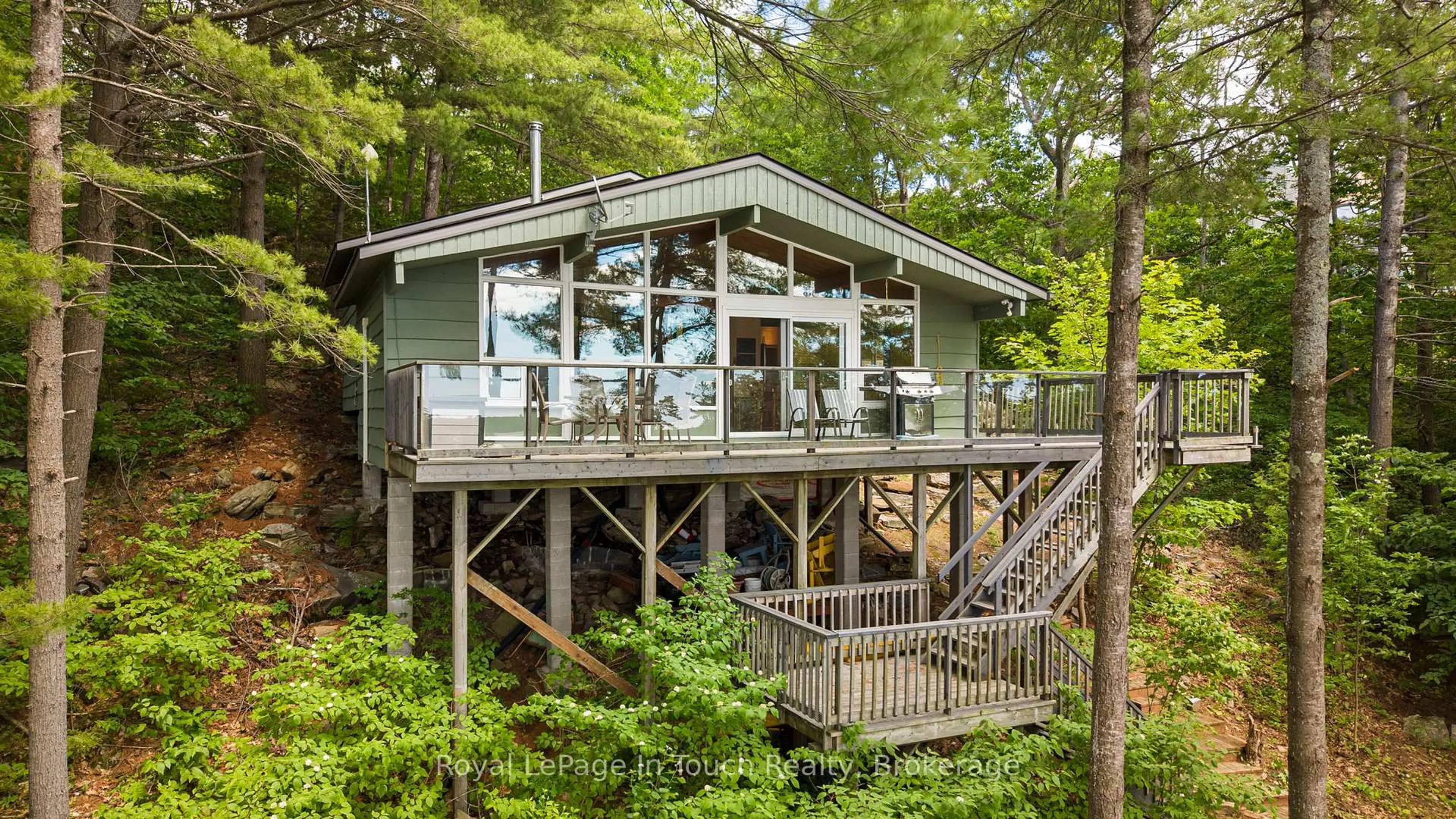 Home with vinyl exterior material, forest/trees view for 3946 East Shore Rd, Severn Ontario L0K 1E0