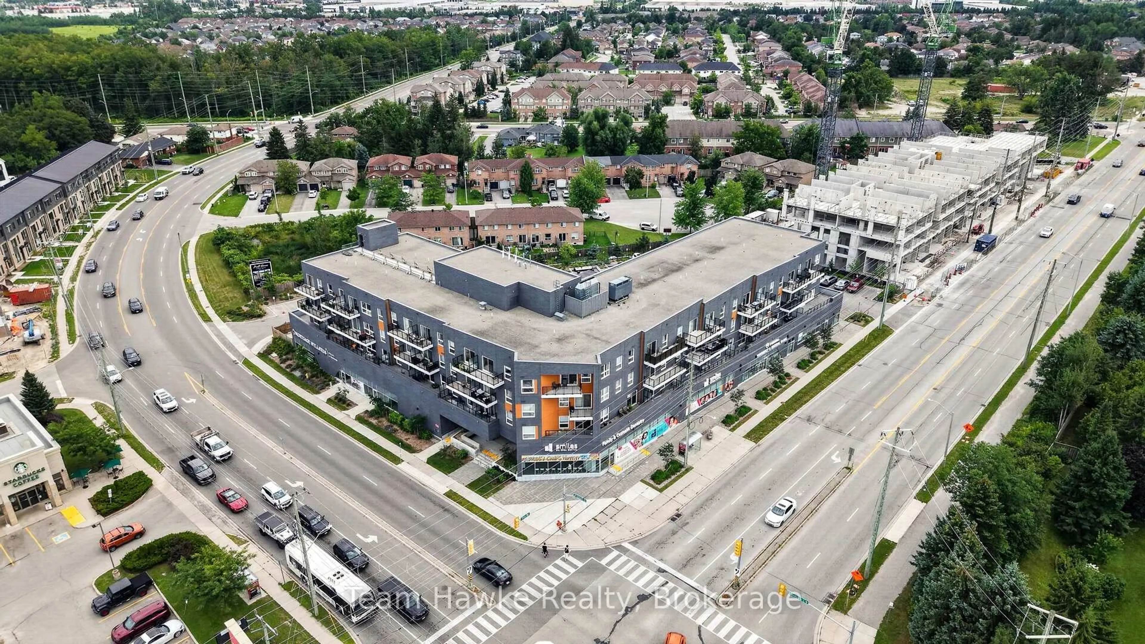 A pic from outside/outdoor area/front of a property/back of a property/a pic from drone, building for 430 Essa Rd #211, Barrie Ontario L9J 0M1