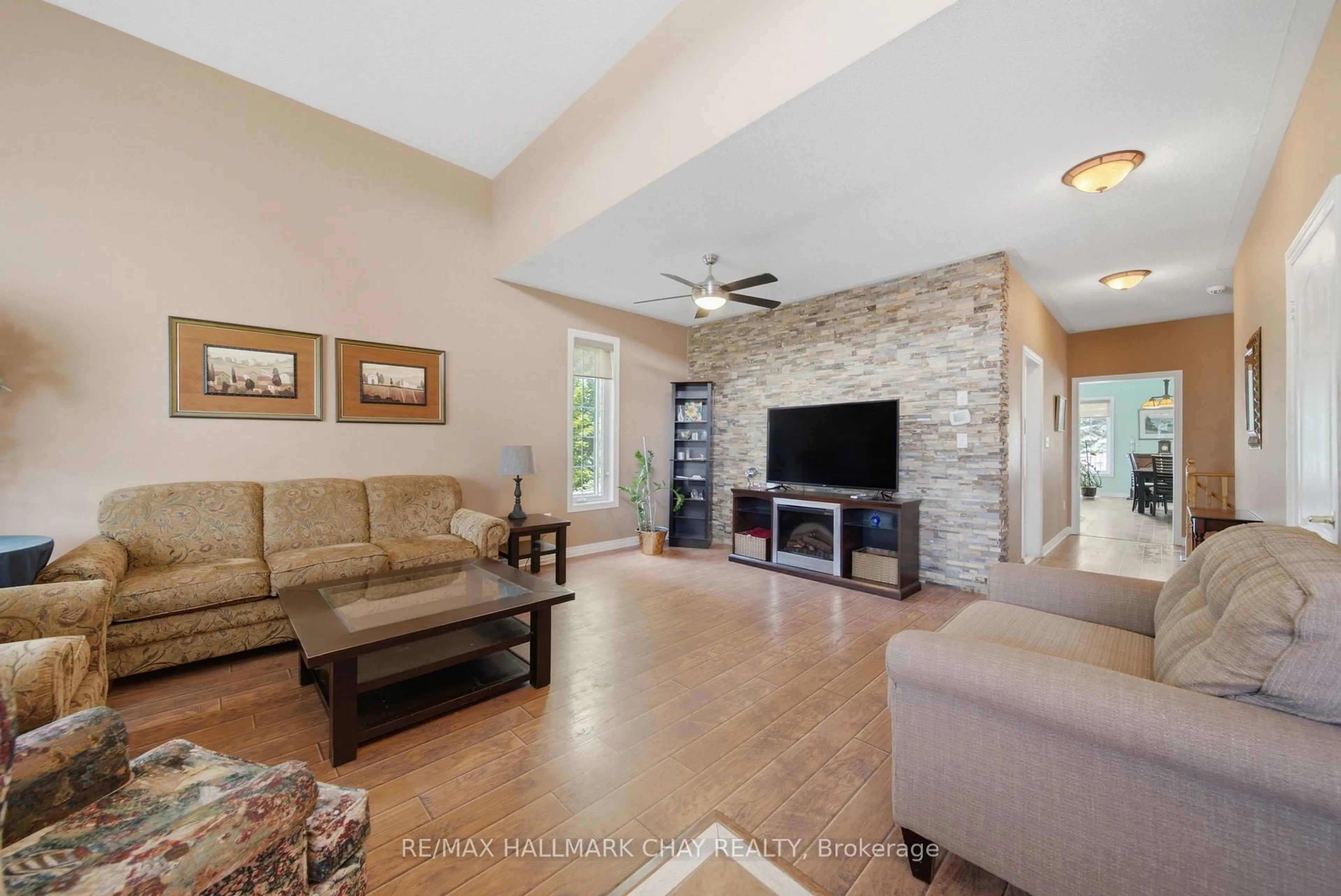 Living room with furniture, ceramic/tile floor for 121 Prince William Way, Barrie Ontario L4M 7H6