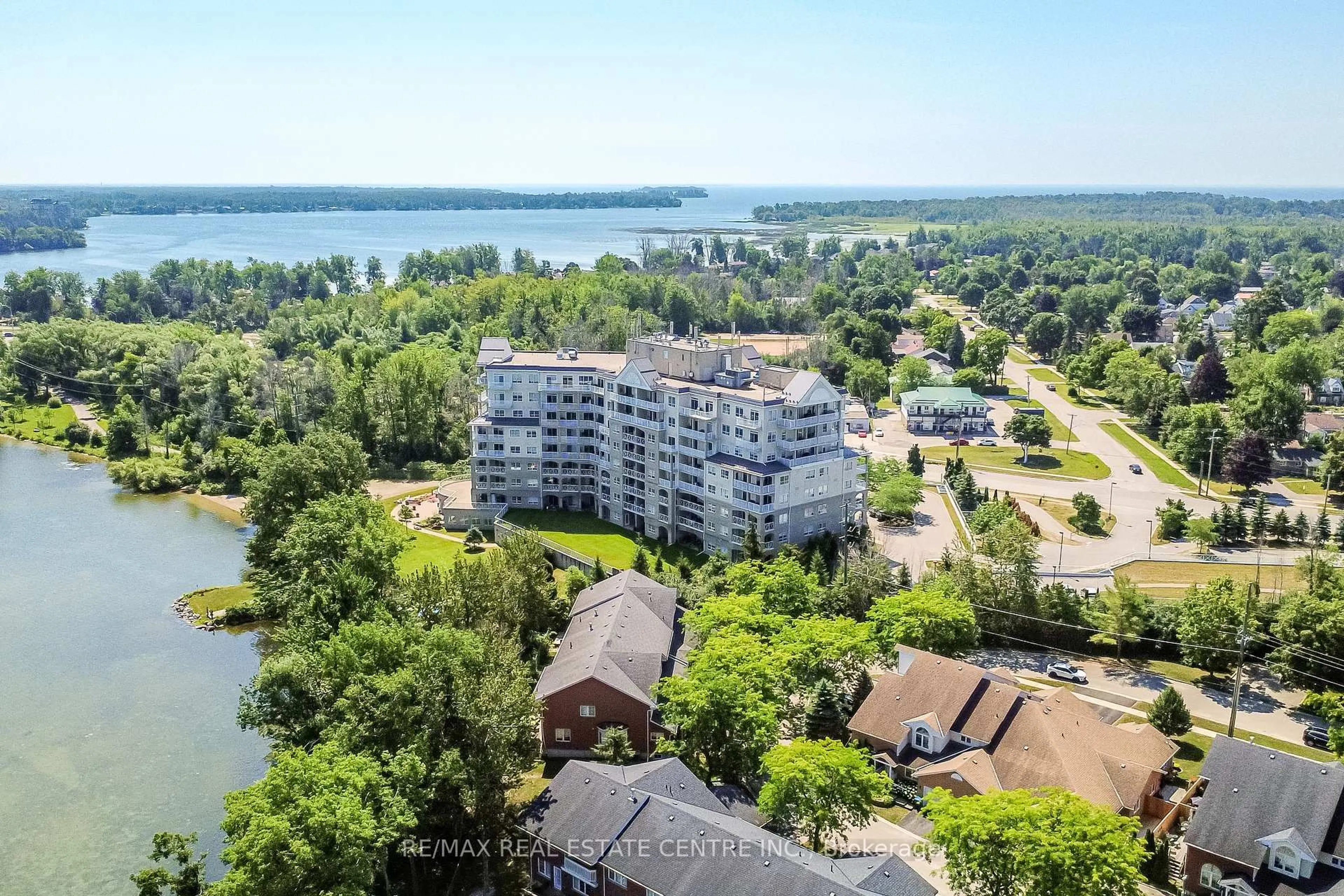 A pic from outside/outdoor area/front of a property/back of a property/a pic from drone, water/lake/river/ocean view for 354 Atherley Rd #213, Orillia Ontario L3V 0B8