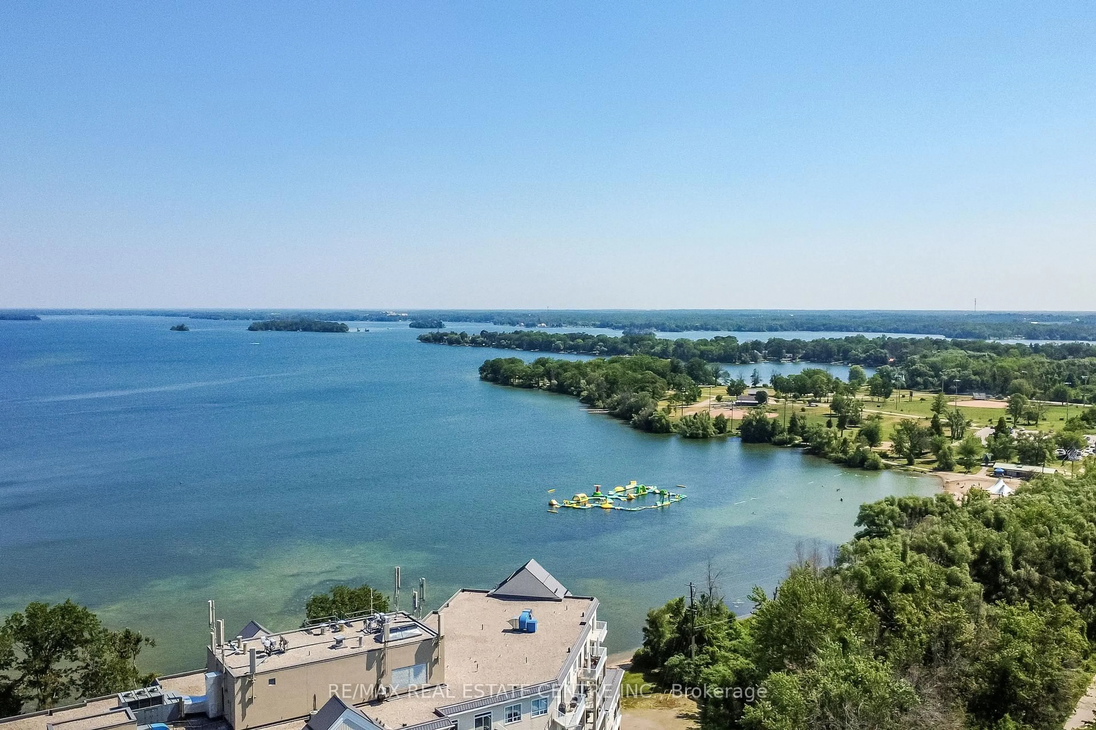 A pic from outside/outdoor area/front of a property/back of a property/a pic from drone, water/lake/river/ocean view for 354 Atherley Rd #213, Orillia Ontario L3V 0B8