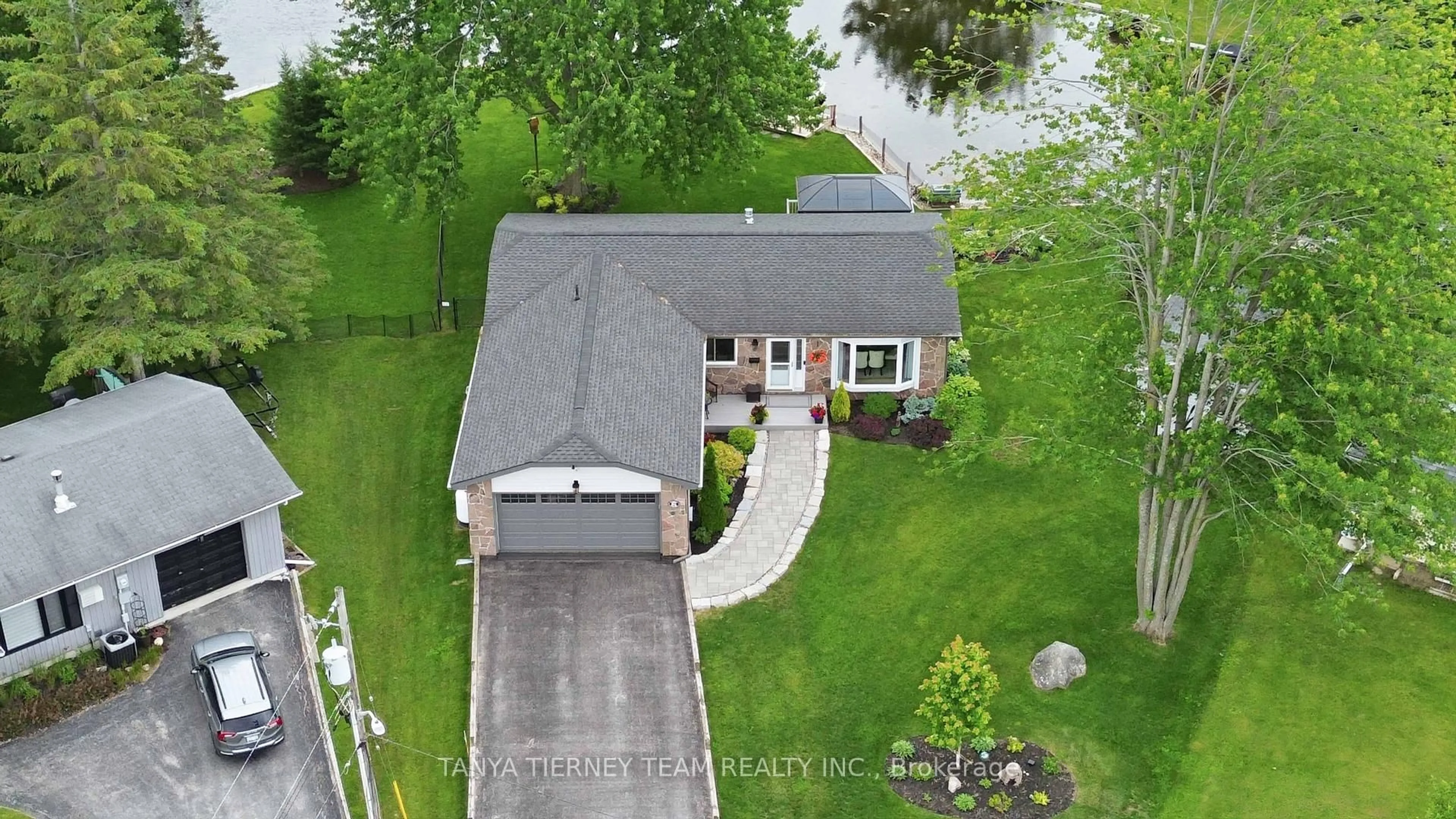 A pic from outside/outdoor area/front of a property/back of a property/a pic from drone, street for 84 Turtle Path, Ramara Ontario L0K 1B0