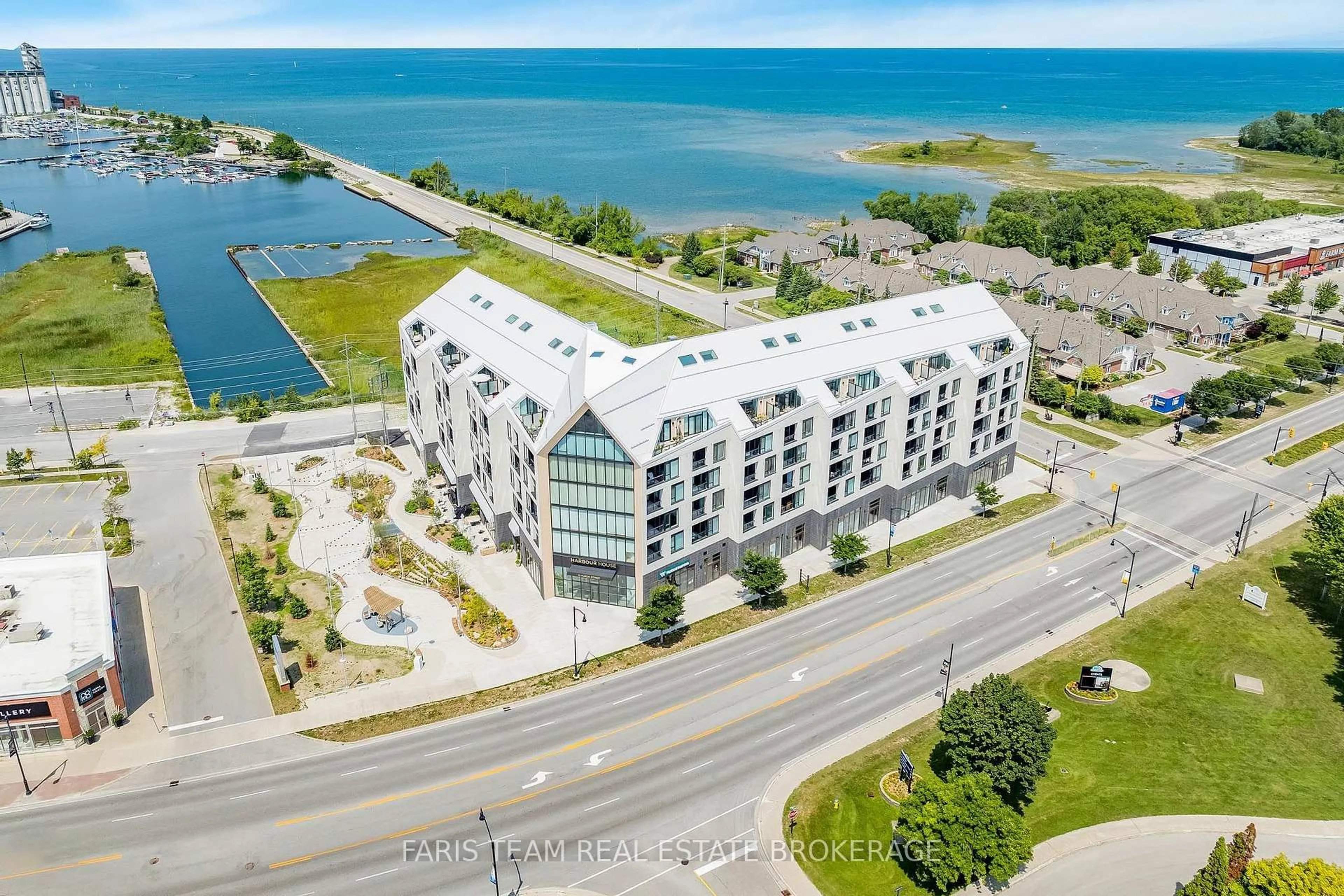A pic from outside/outdoor area/front of a property/back of a property/a pic from drone, water/lake/river/ocean view for 31 Huron St #417, Collingwood Ontario L9Y 1C3