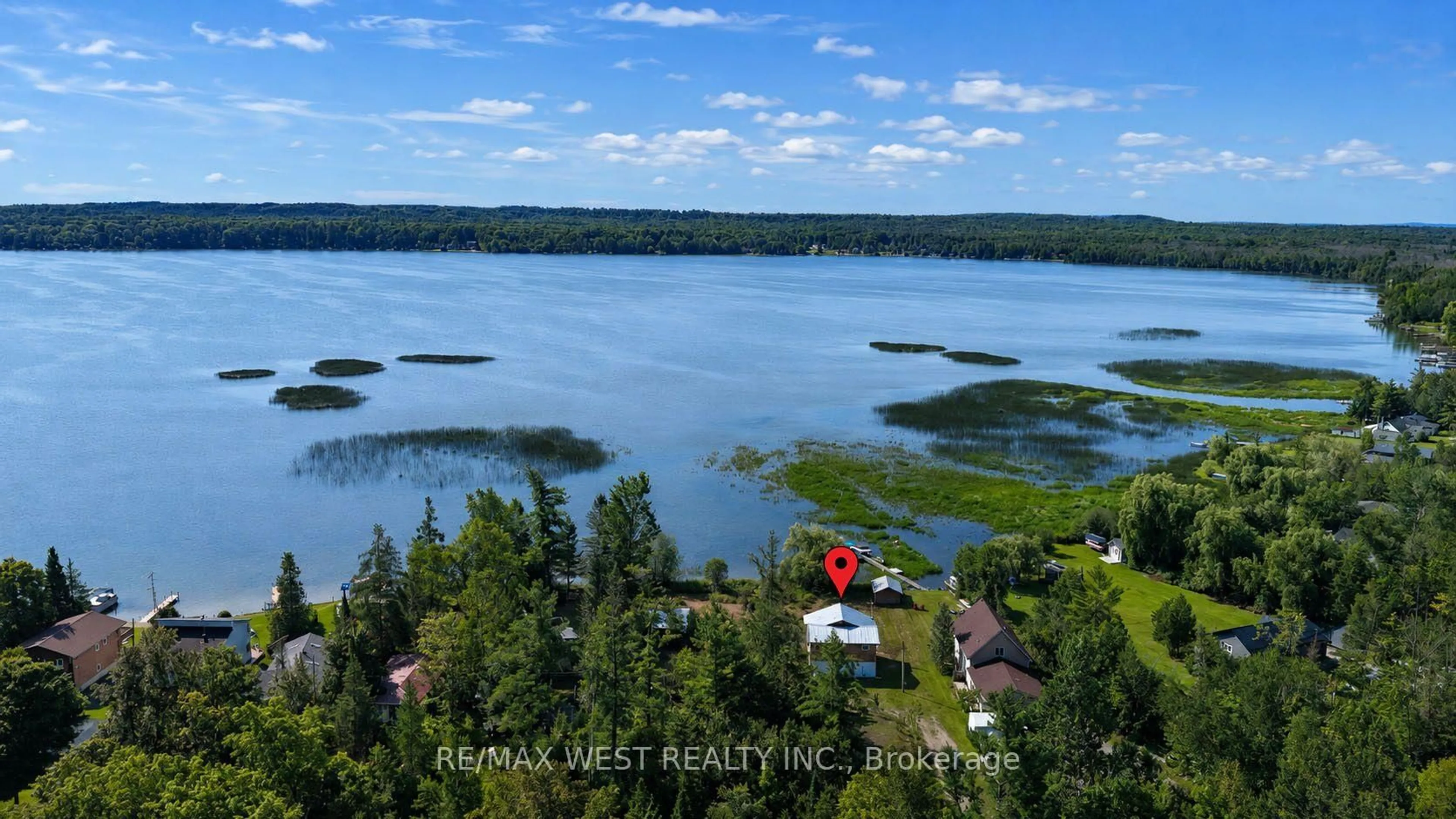 A pic from outside/outdoor area/front of a property/back of a property/a pic from drone, water/lake/river/ocean view for 2137 North Orr Lake Rd, Springwater Ontario L0L 1P0