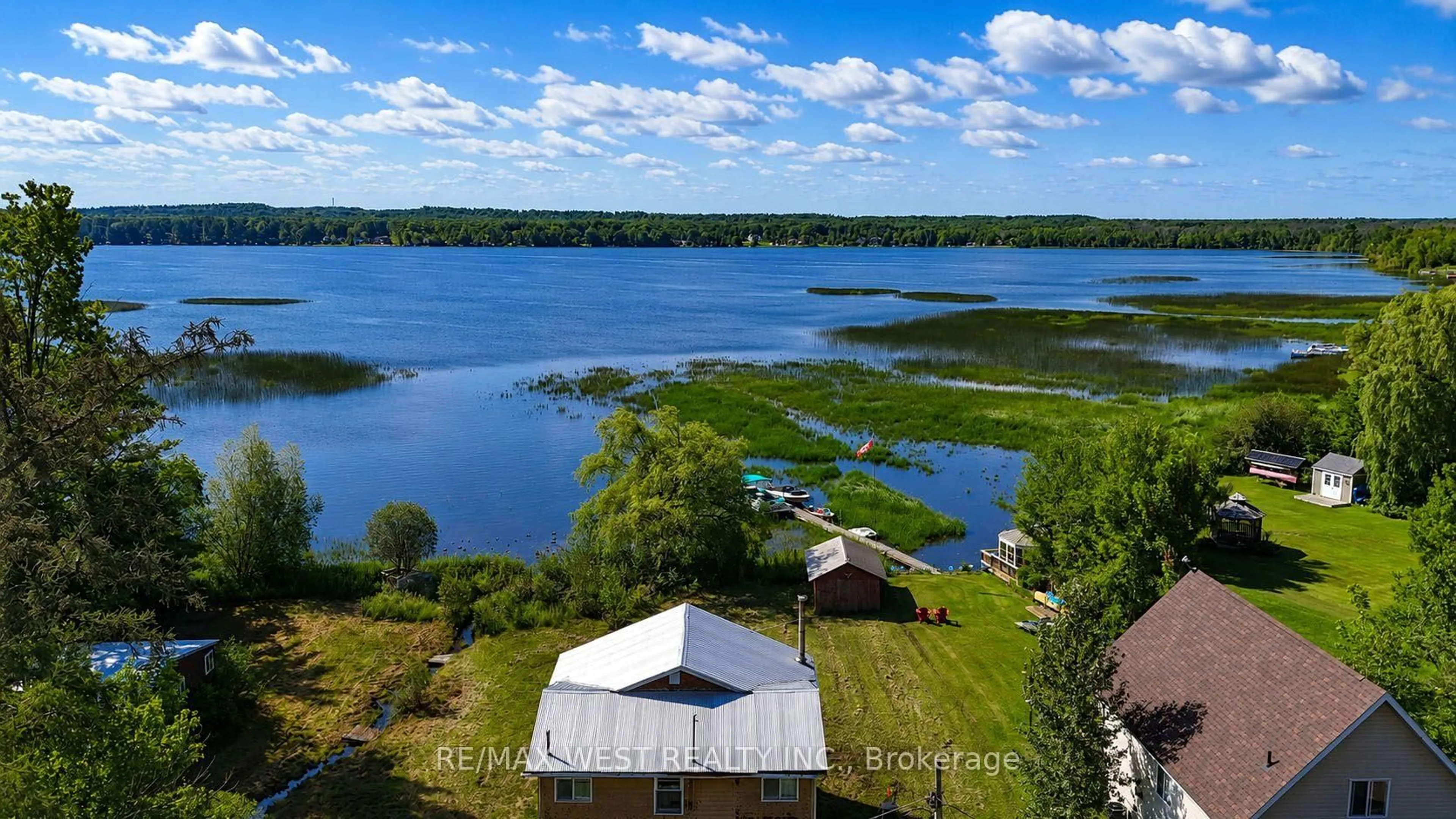 A pic from outside/outdoor area/front of a property/back of a property/a pic from drone, water/lake/river/ocean view for 2137 North Orr Lake Rd, Springwater Ontario L0L 1P0