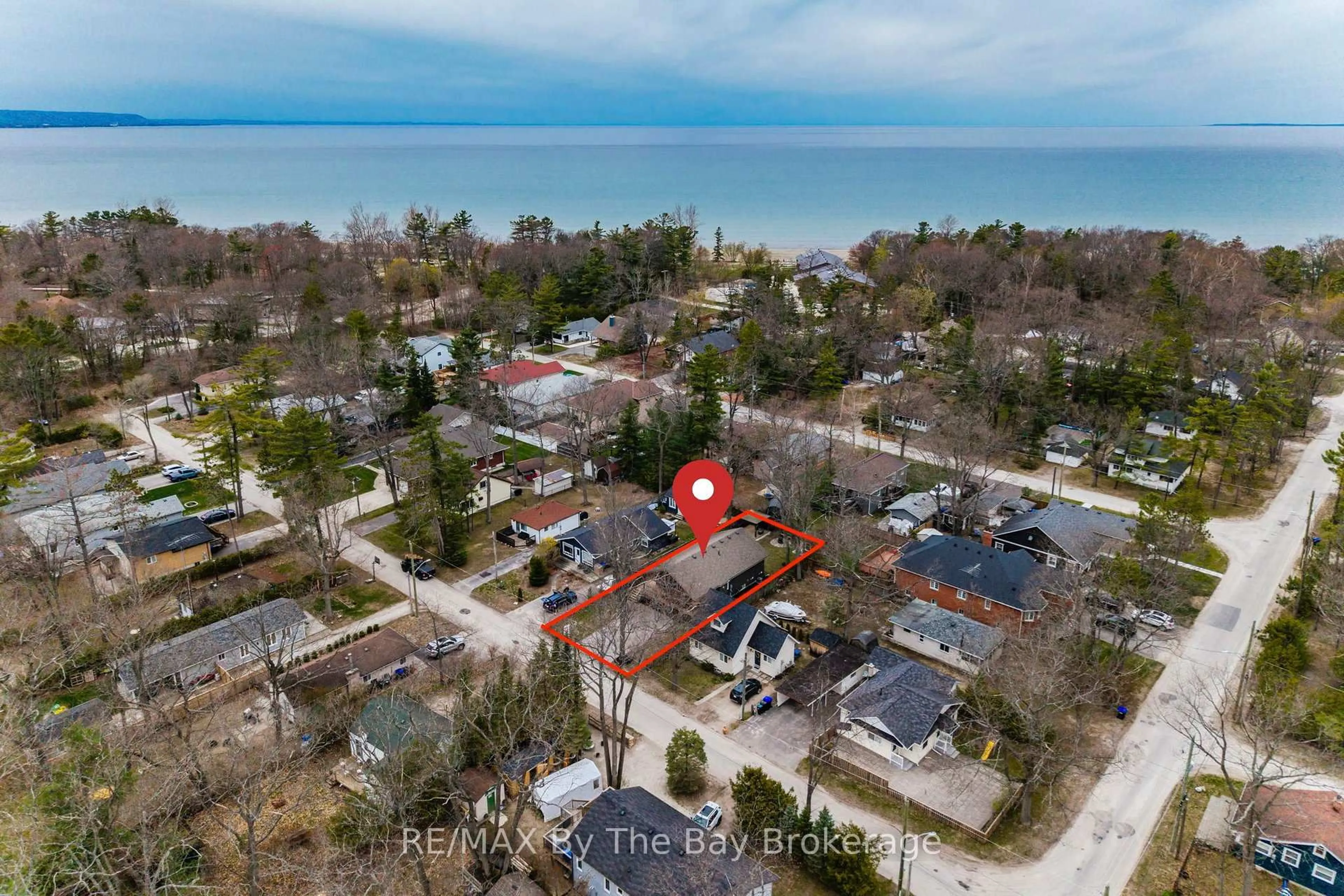 A pic from outside/outdoor area/front of a property/back of a property/a pic from drone, water/lake/river/ocean view for 12 5th Lane, Wasaga Beach Ontario L9Z 2E9