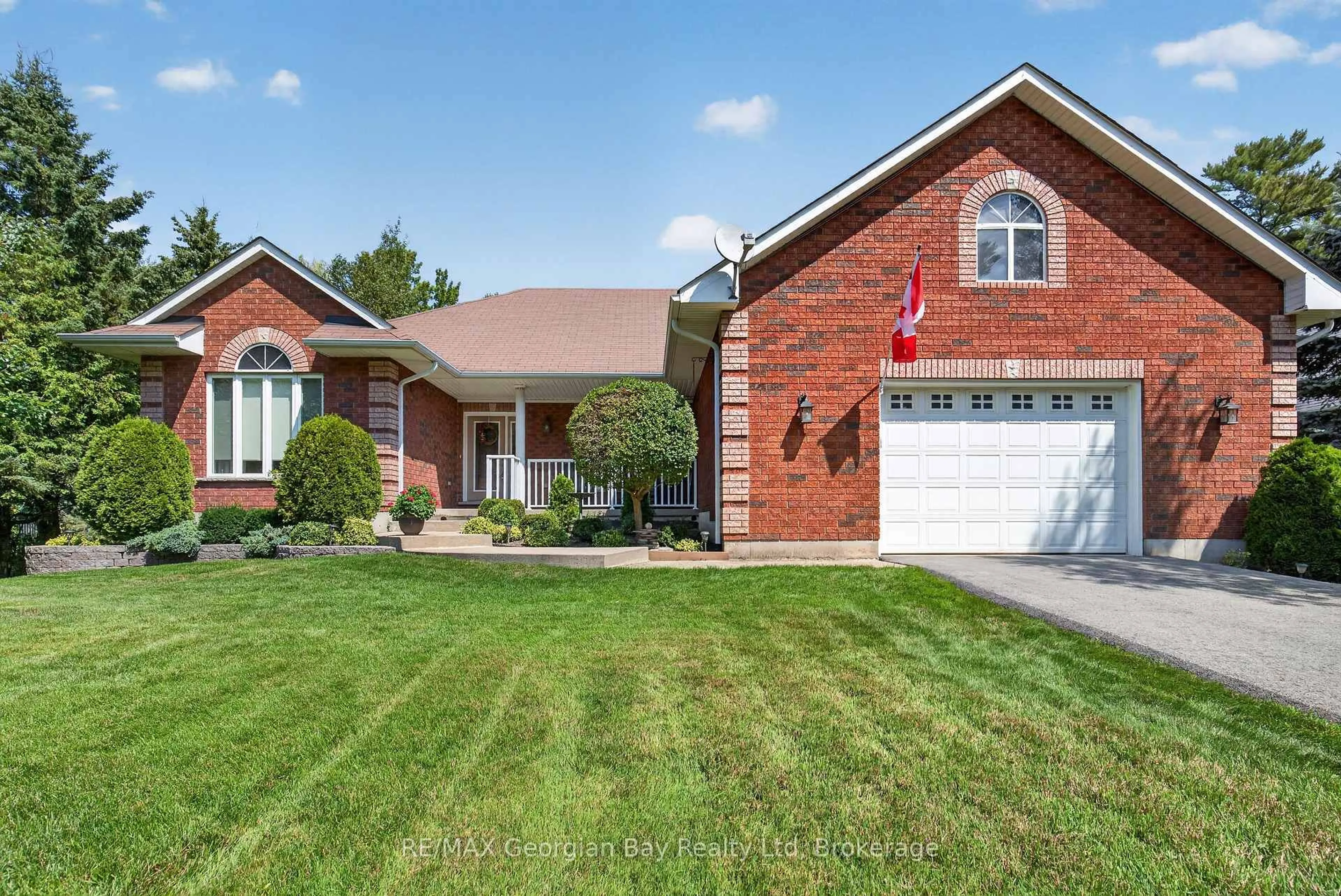Home with brick exterior material, street for 1339 Tiny Beaches Rd, Tiny Ontario L9M 0H3