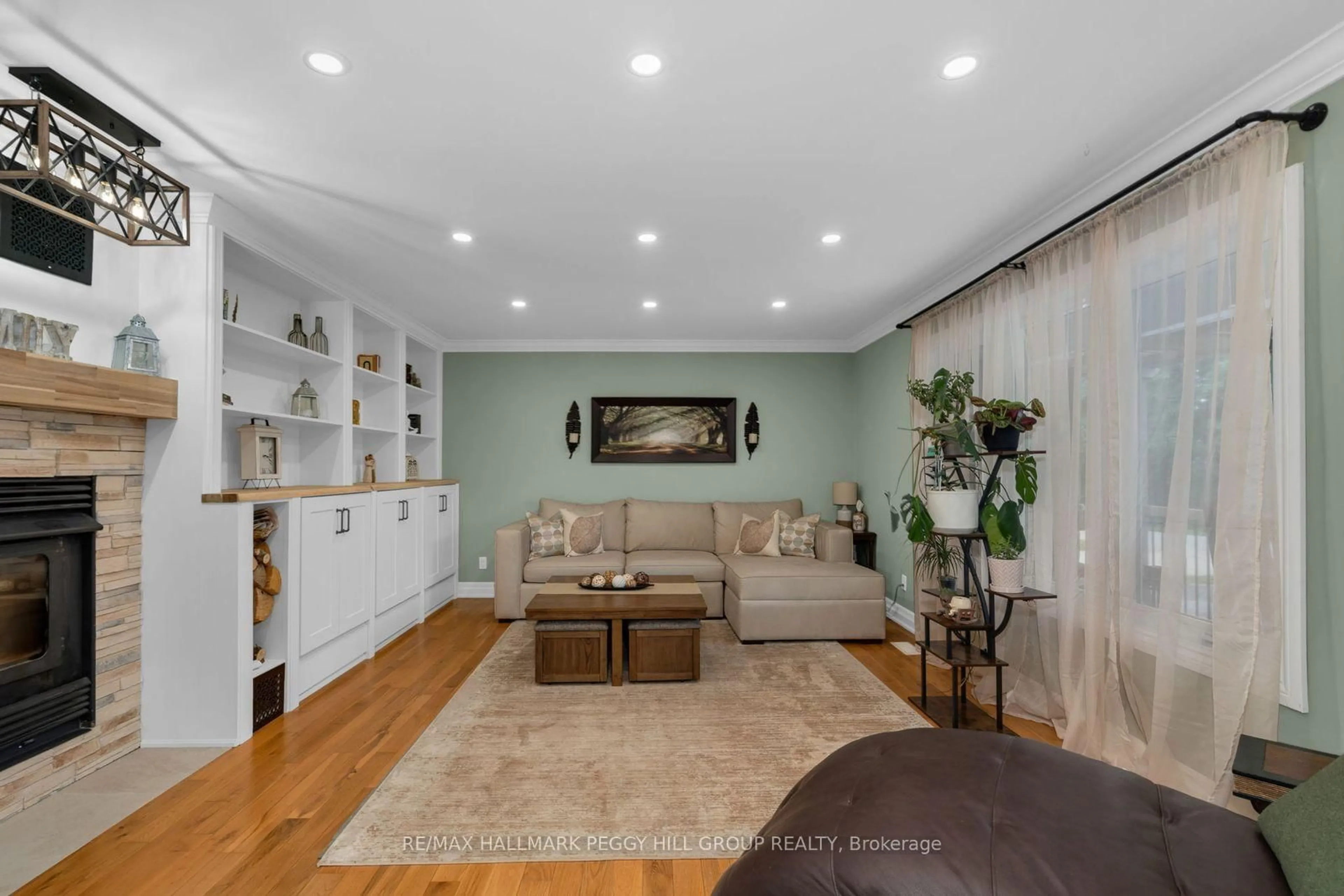 Living room with furniture, wood/laminate floor for 2889 Fairgrounds Rd, Clearview Ontario L0M 1G0