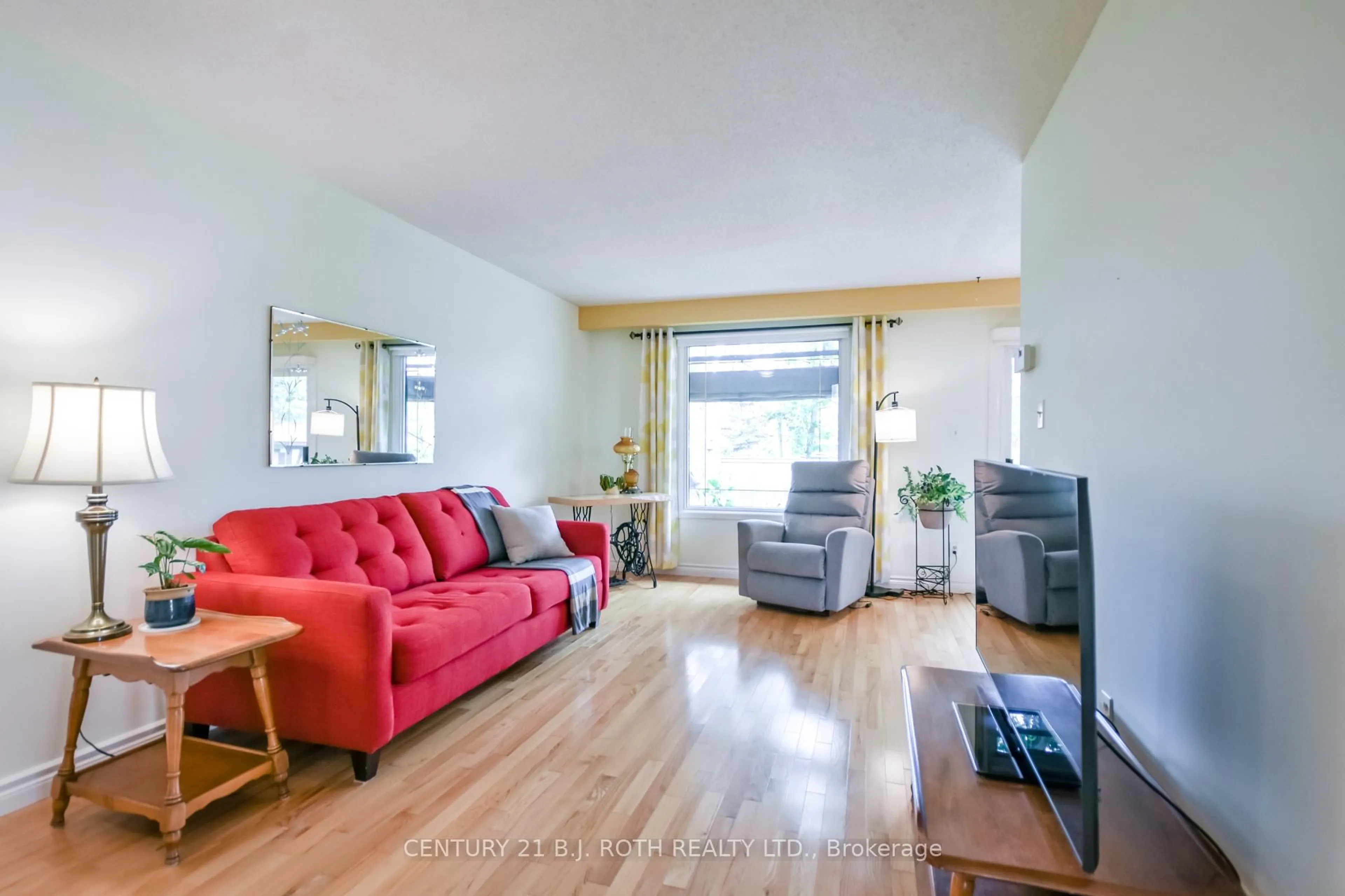Living room with furniture, wood/laminate floor for 53 Mowat Cres, Barrie Ontario L4N 5B4
