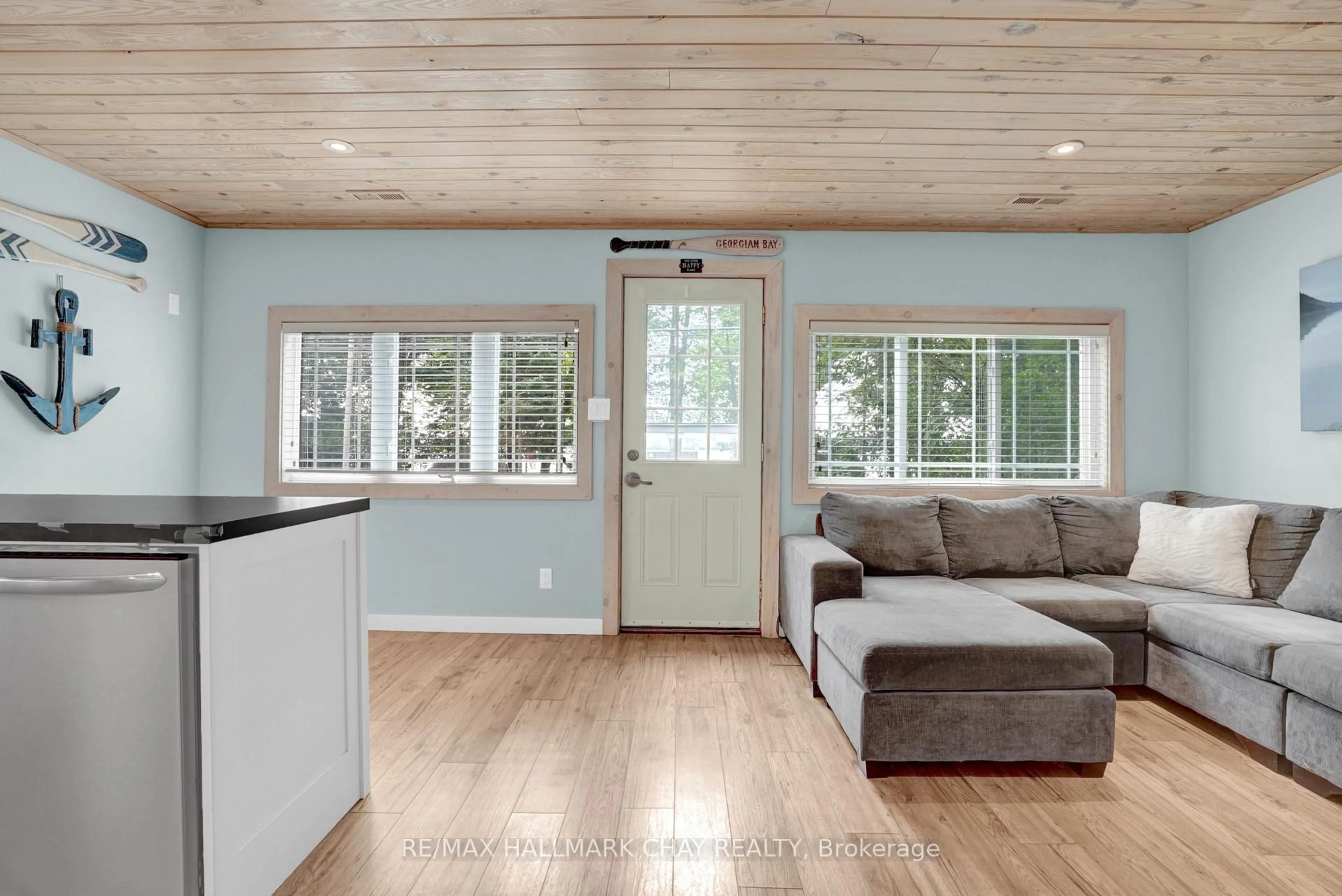 Living room with furniture, wood/laminate floor for 375 Robins Point Rd, Tay Ontario L0K 2A0
