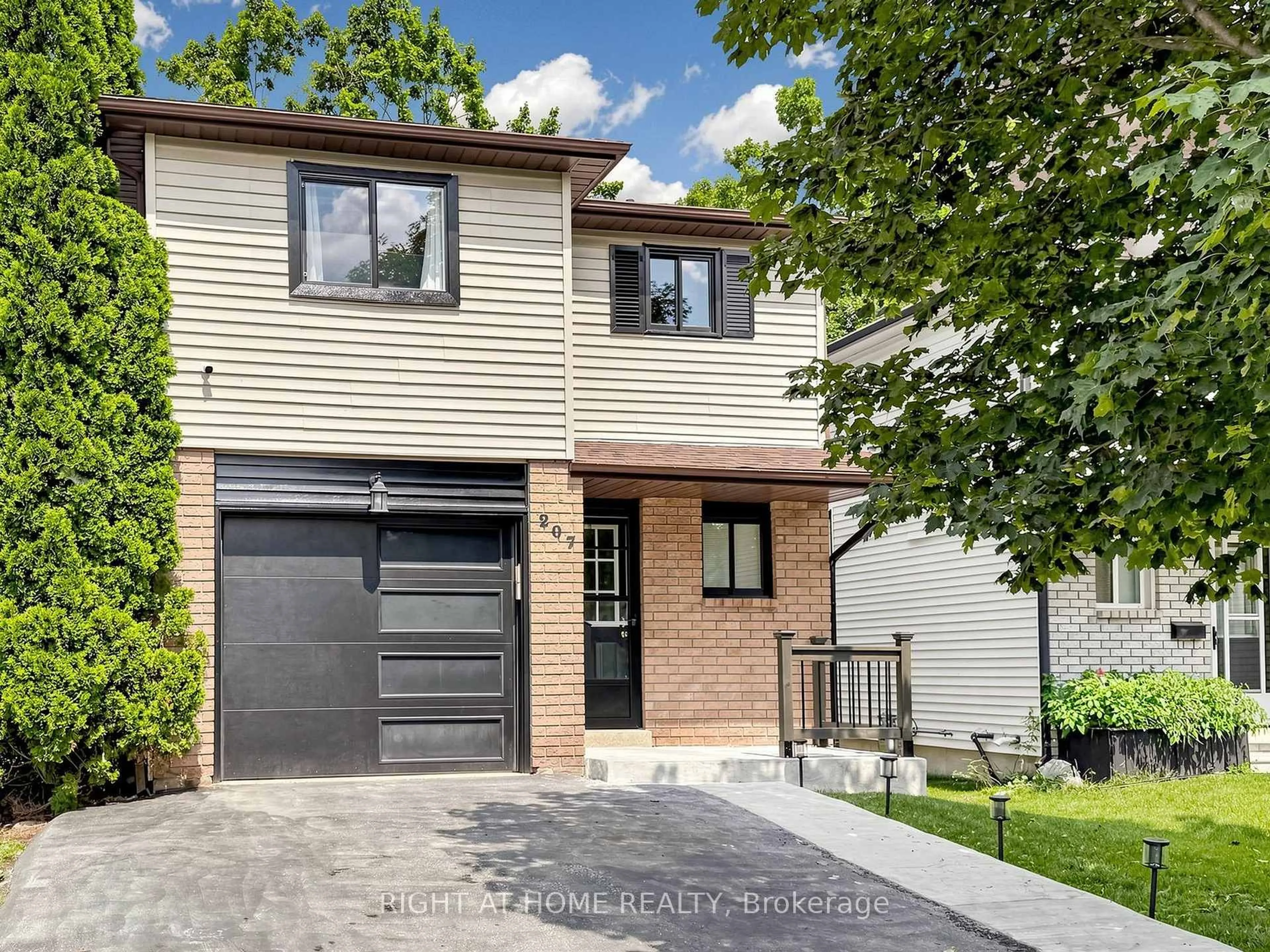Home with brick exterior material, street for 207 Hickling Tr, Barrie Ontario L4M 5W6