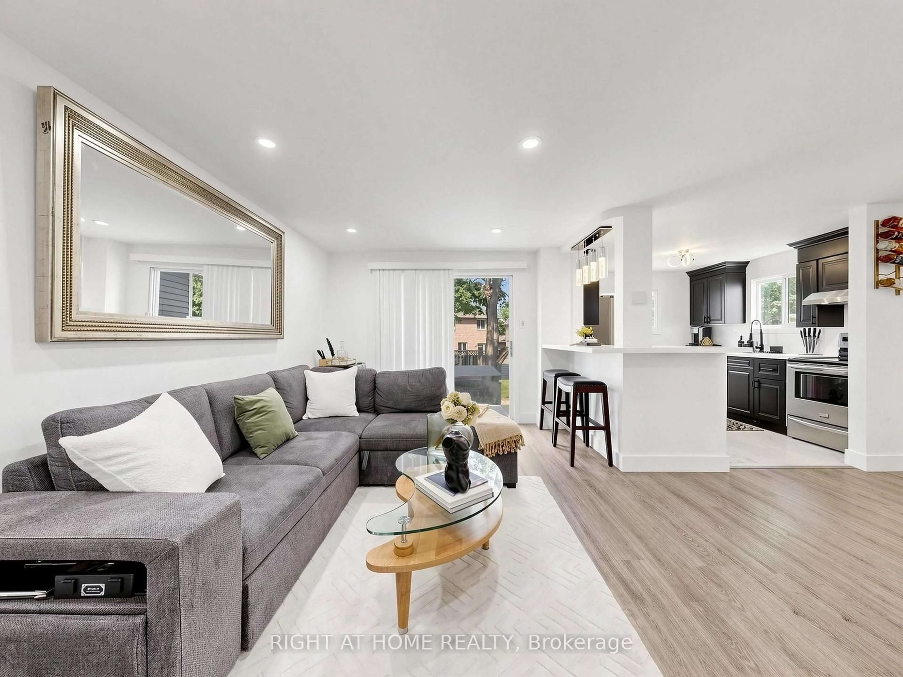 Living room with furniture, unknown for 207 Hickling Tr, Barrie Ontario L4M 5W6