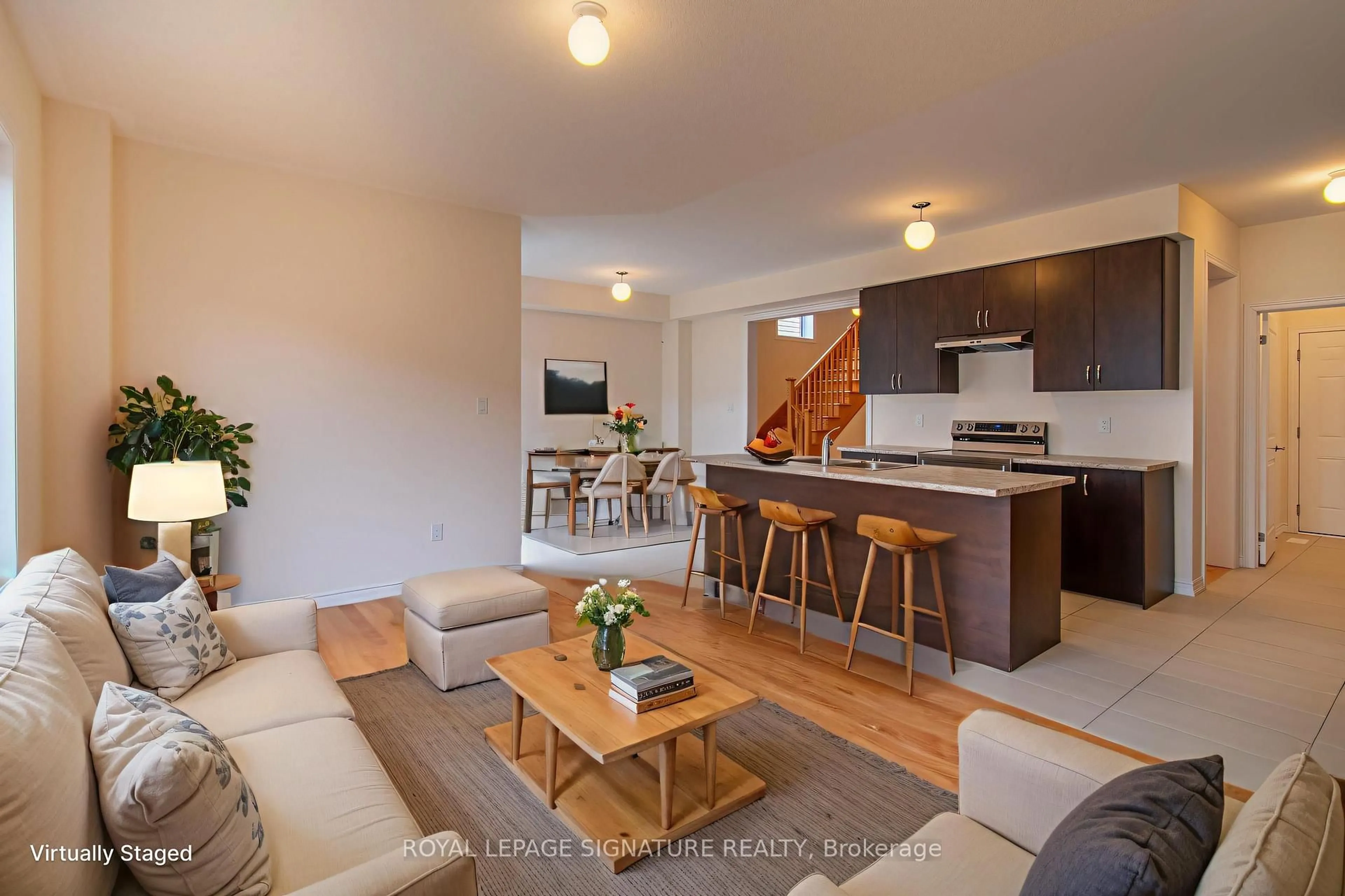 Living room with furniture, wood/laminate floor for 22 Prudhoe Terr, Barrie Ontario L9S 2Z8